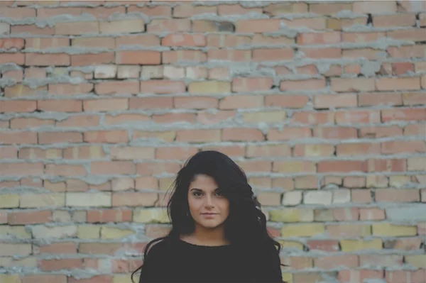 woman brick wall.jpg