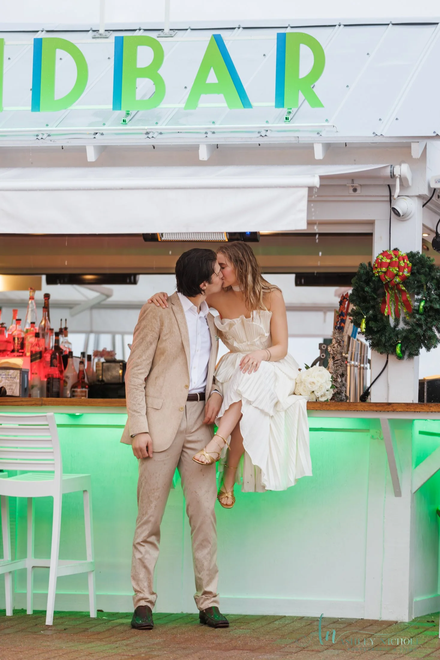Bride and Groom kiss at Pickles Sandbar in Seaside, Florida on 30A