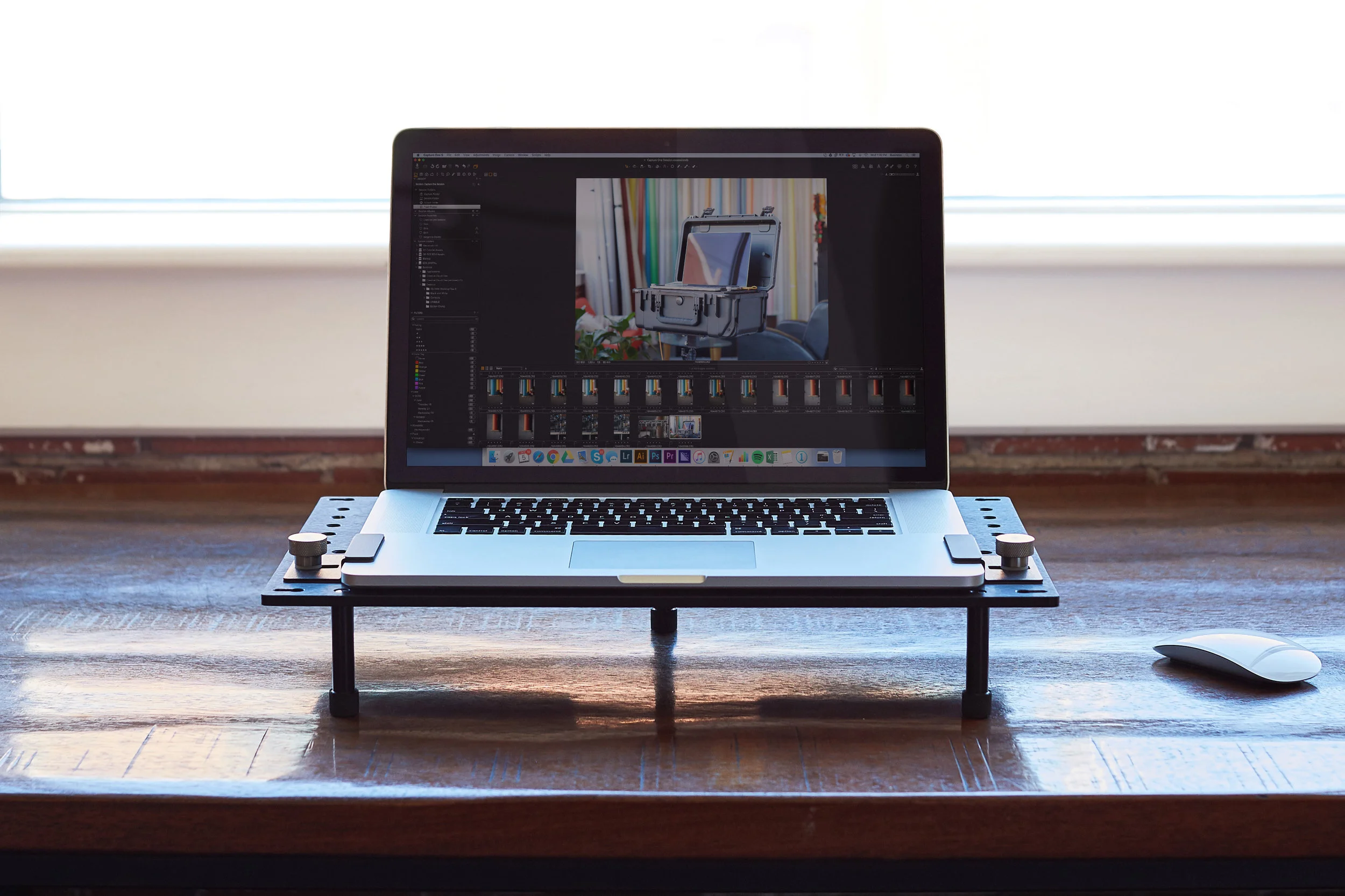 The DigiPlate removed and placed on a desk. The three legs are included to allow elevated operation on a table. 