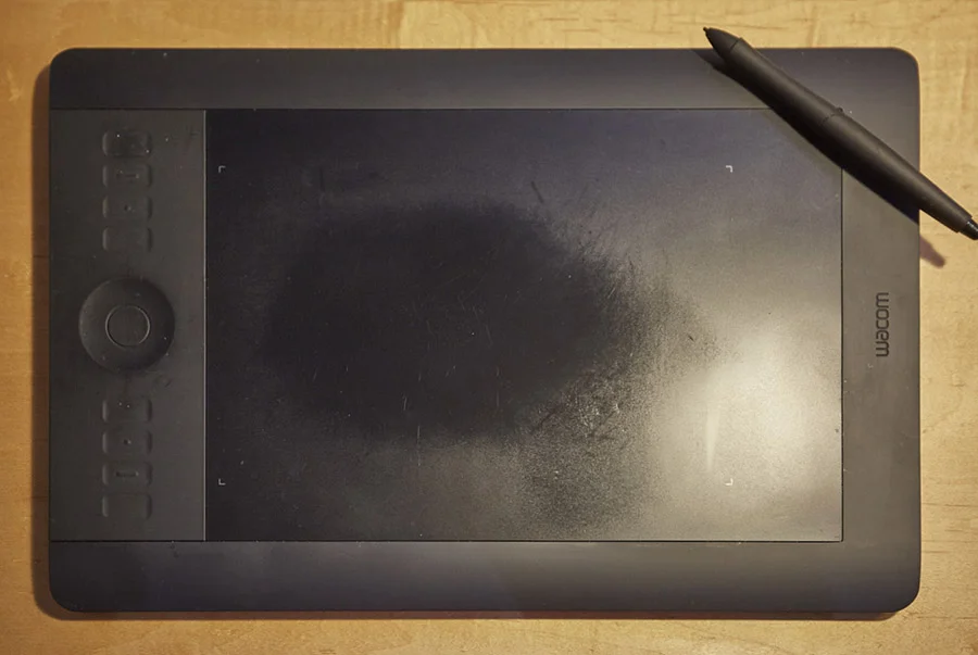 This first gen Intuos Pro showing some signs of use and love. The smoothed shiny surface the result of heavy use. 