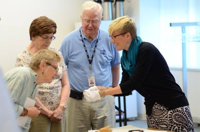 Jess shares an artifact at the Abraham Lincoln Presidential Library.