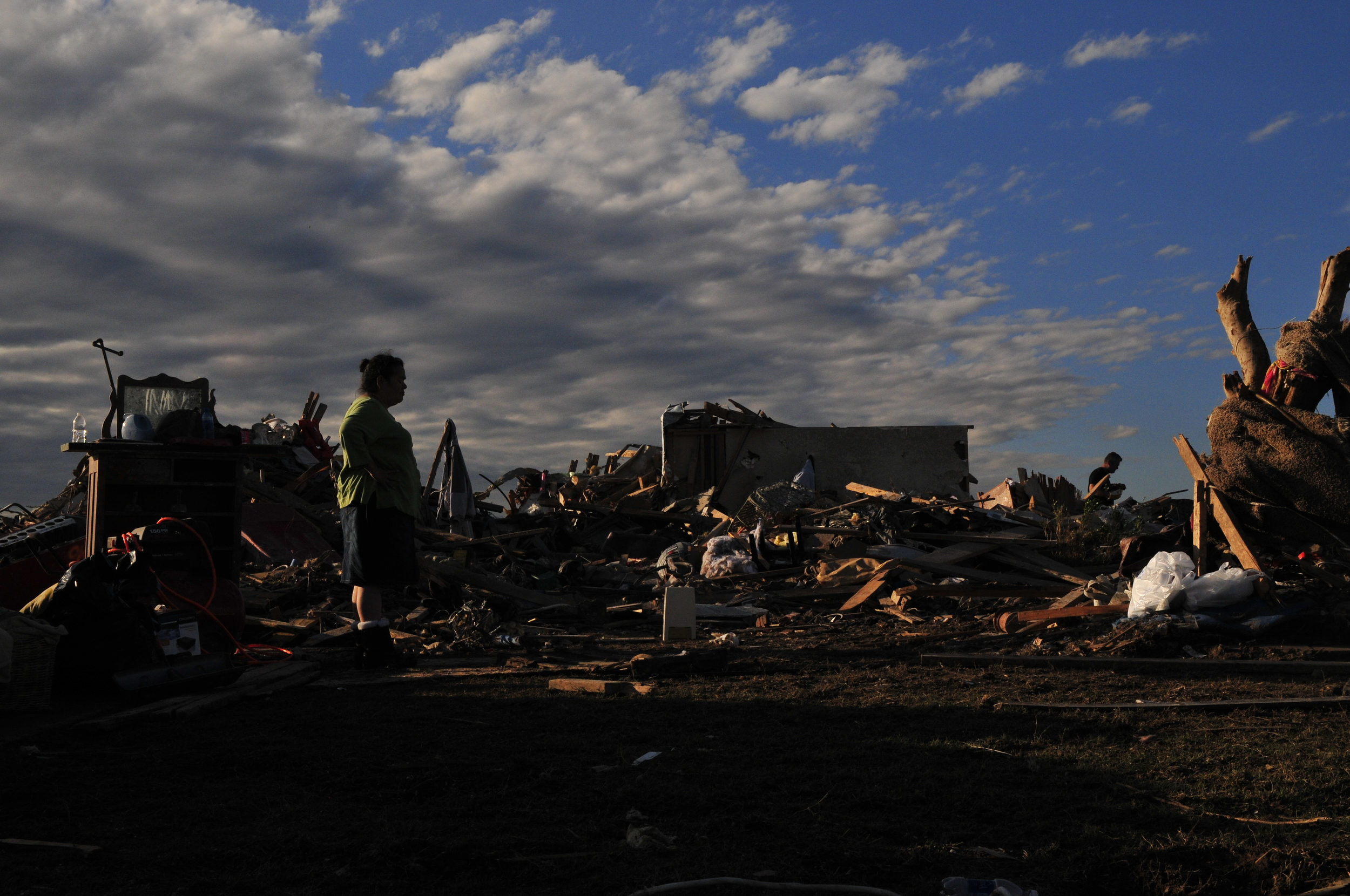  Joyce Moreno stands out front of her brother Gerald's home that was in the direct path of yesterdays EF5&nbsp; tornado on May 21, 2013 in Moore Oklahoma. 