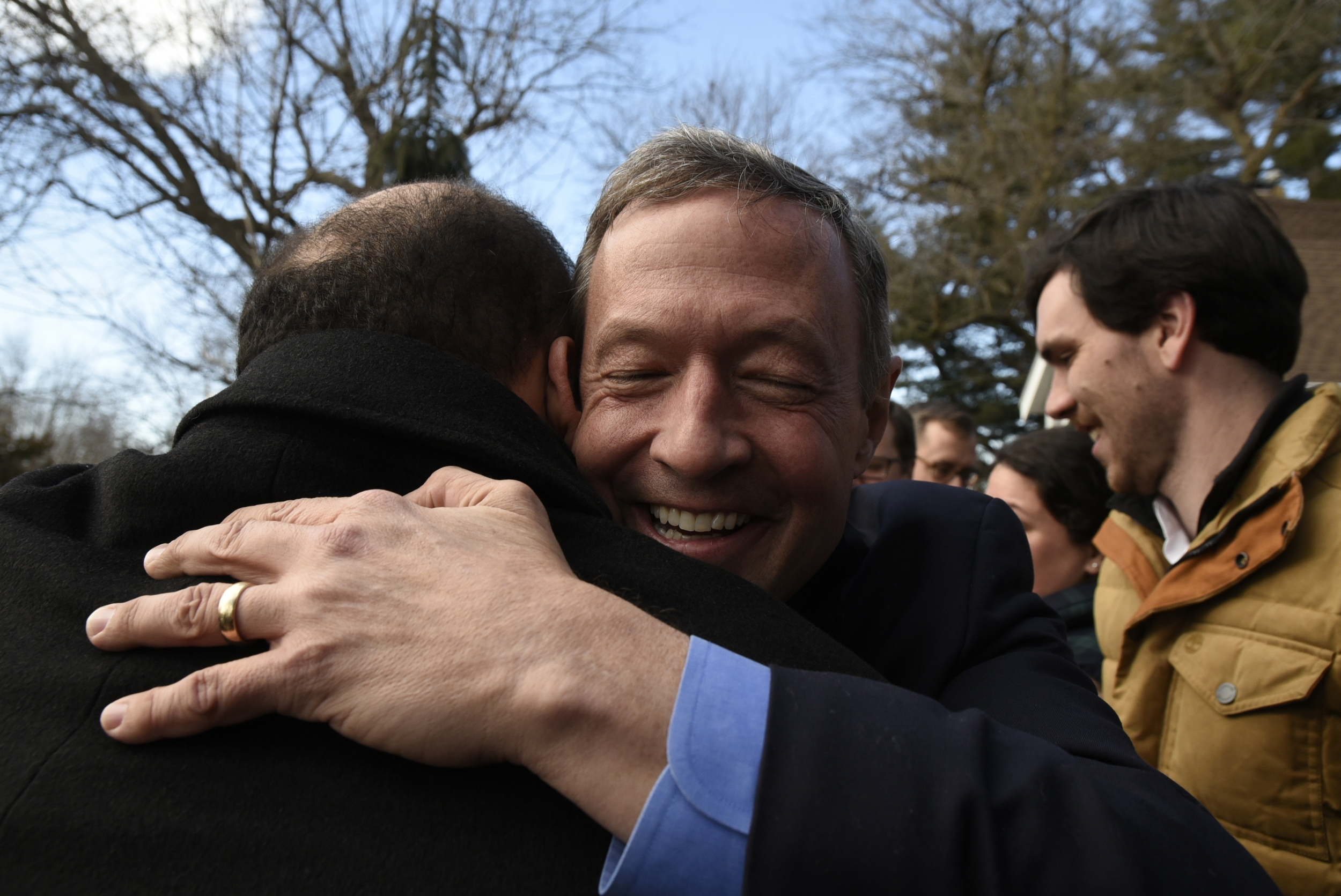  Democrat presidential candidate Martin O'Malley embraces a supporter at a door knocking event the day before the Iowa Caucuses in Des Moines Iowa. 