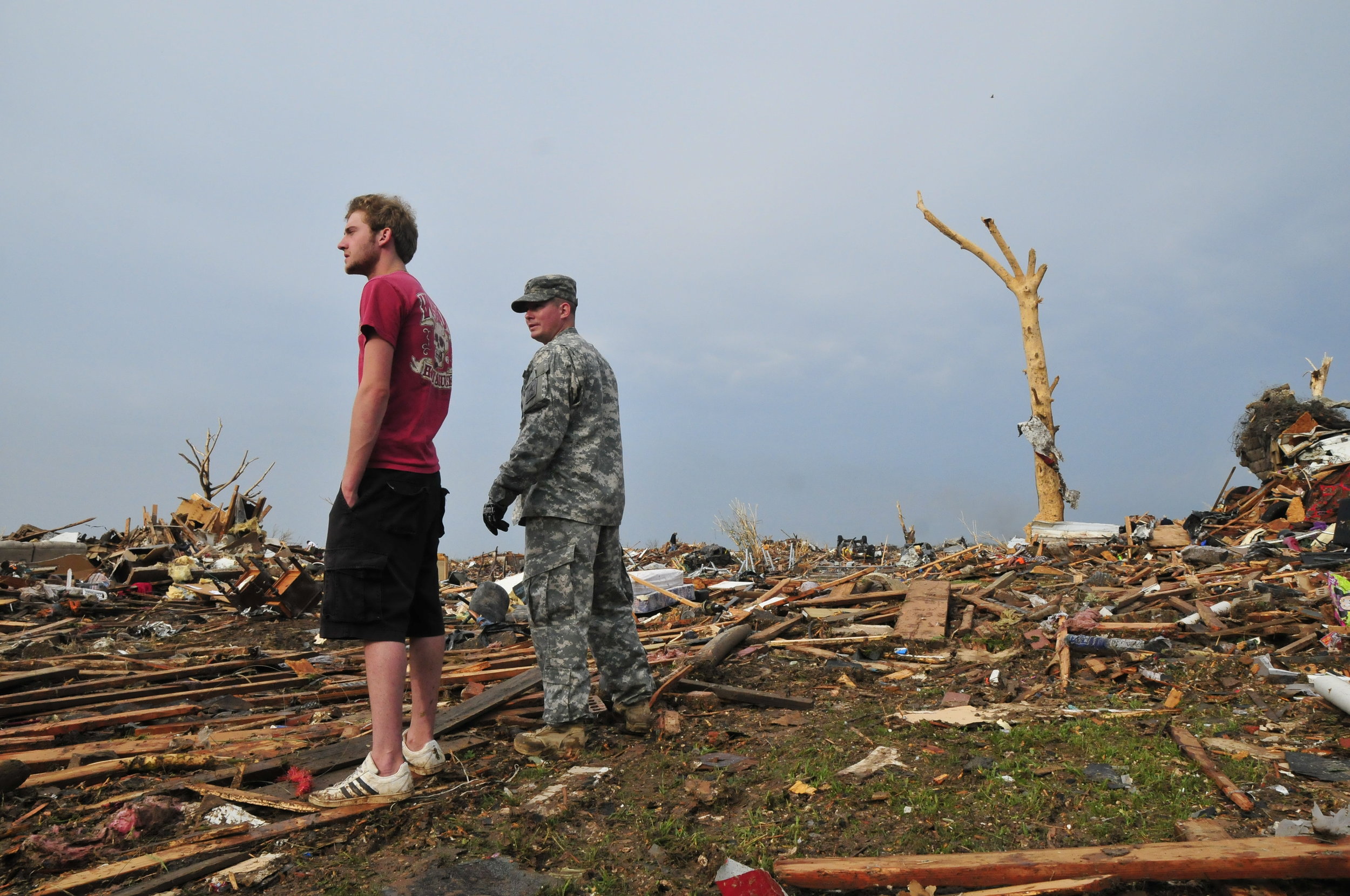  A National Guardsmen and resident in a neighborhood destroyed by the tornado on May, 20 in Moore Oklahoma 