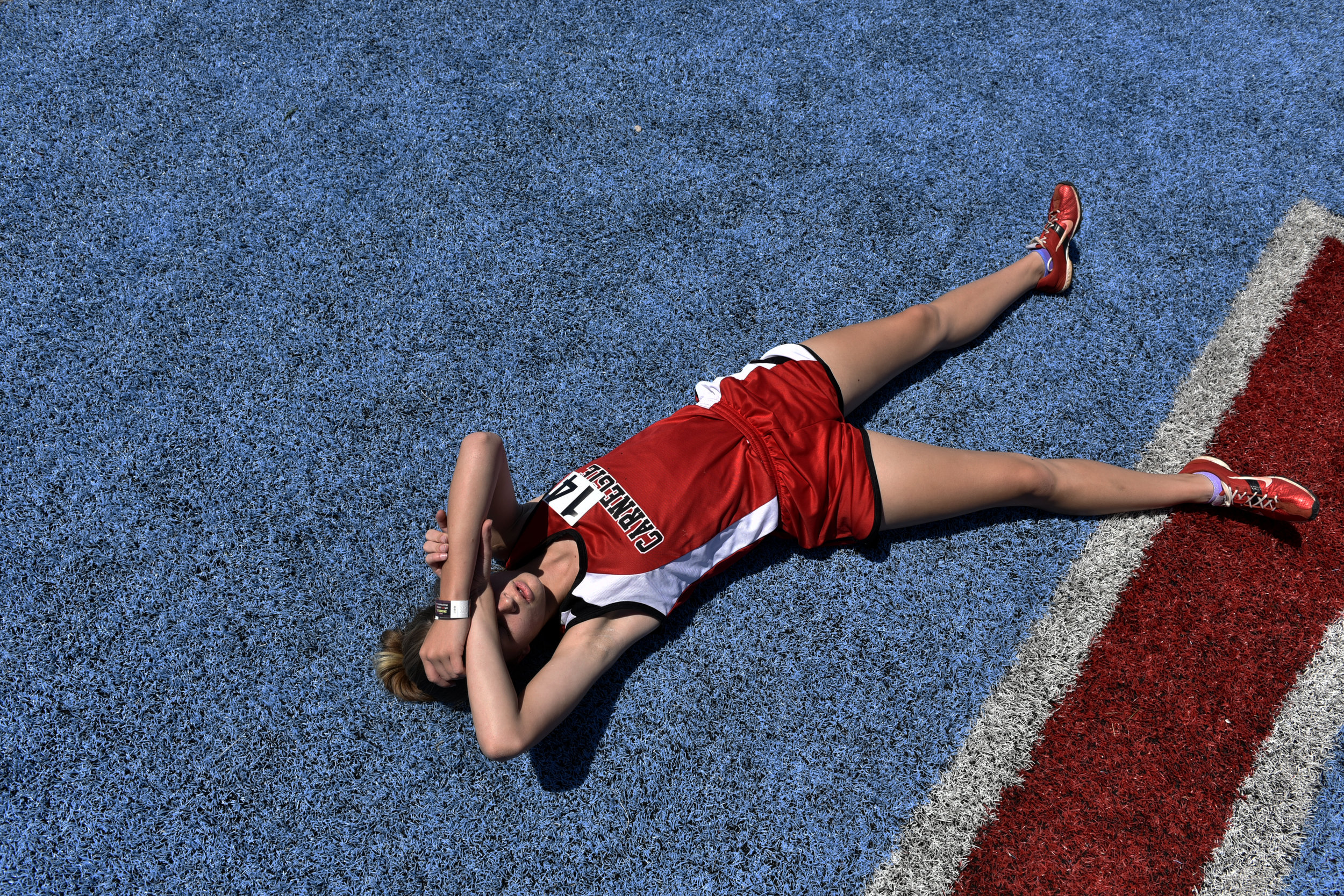  Kennedy Kiesau, a freshman at Carnegie High School, takes a break after running in the 800 meter race during the Class A and 2A track championships at Western Heights High School, Saturday, May 5, 2018. Photo by Nick Oxford for The Oklahoman 