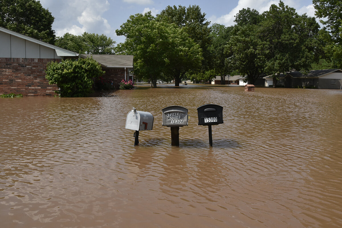   Floodwater surrounds mailboxes in the Town and Country neighborhood in Sand Springs, Oklahoma Nick Oxford for The New York Times 