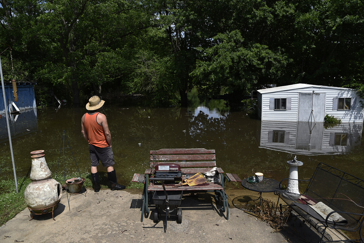 John Weber watches rising floodwater at a friends home in Muskogee, Oklahoma on May 25, 2019.  Nick Oxford for The New York Times 