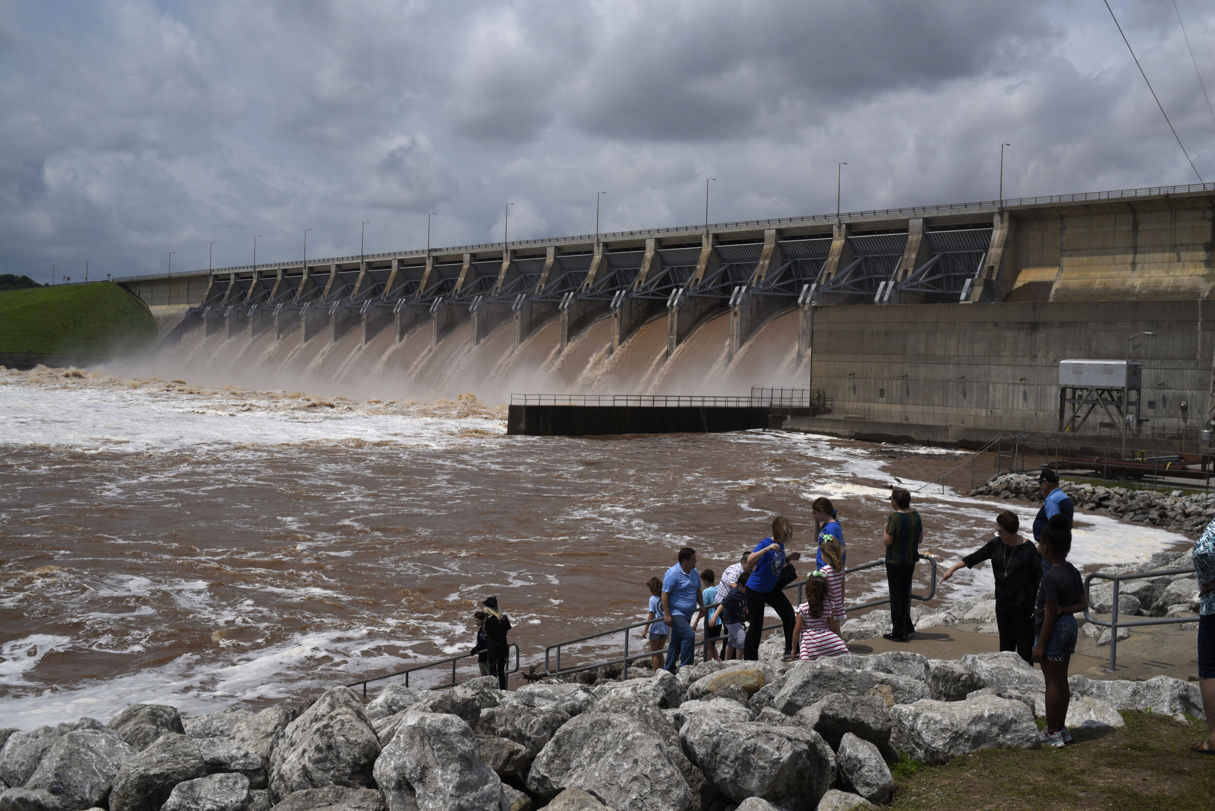  Spectators watch as water flows through Keystone Dam into the Arkansas River which has caused massive flooding downstream in Sand Springs, Oklahoma on May 24, 2019. Nick Oxford for The New York Times 