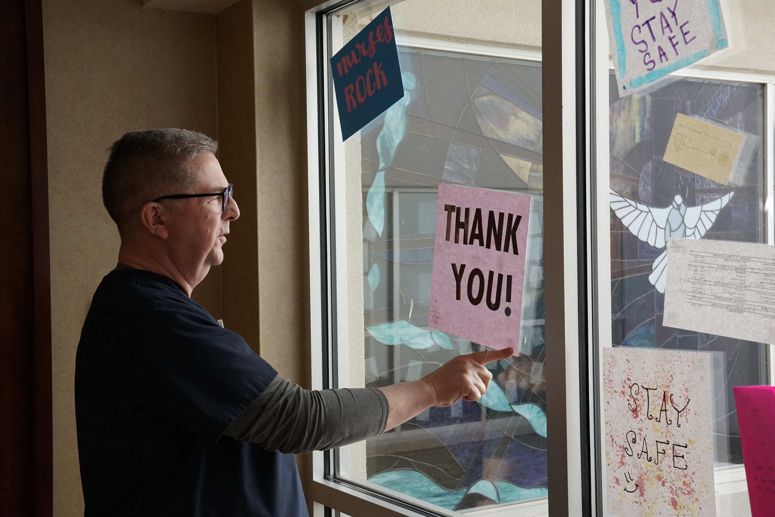  Board Certified Chaplain Bill Simpson hangs up cards of support from the community at SSM Health St. Anthony Hospital amid the spread of the coronavirus disease (COVID-19), in Shawnee, Oklahoma, U.S. April 23, 2020. REUTERS/Nick Oxford 