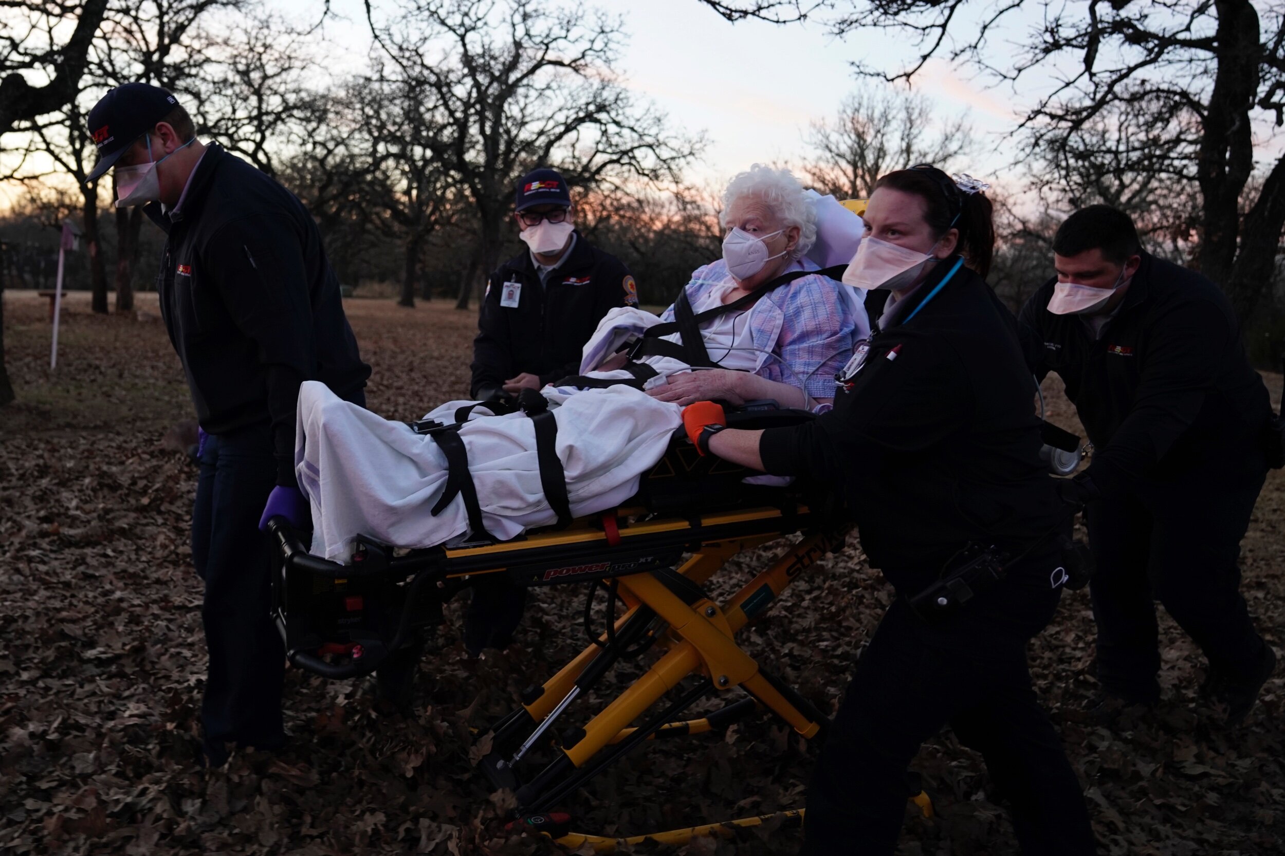   REACT EMS paramedics prepare to transport an 87-year old woman who had been exposed to the coronavirus disease (COVID-19) and was experiencing symptoms in Meeker, Oklahoma, U.S. December 20, 2020. REUTERS/Nick Oxford  