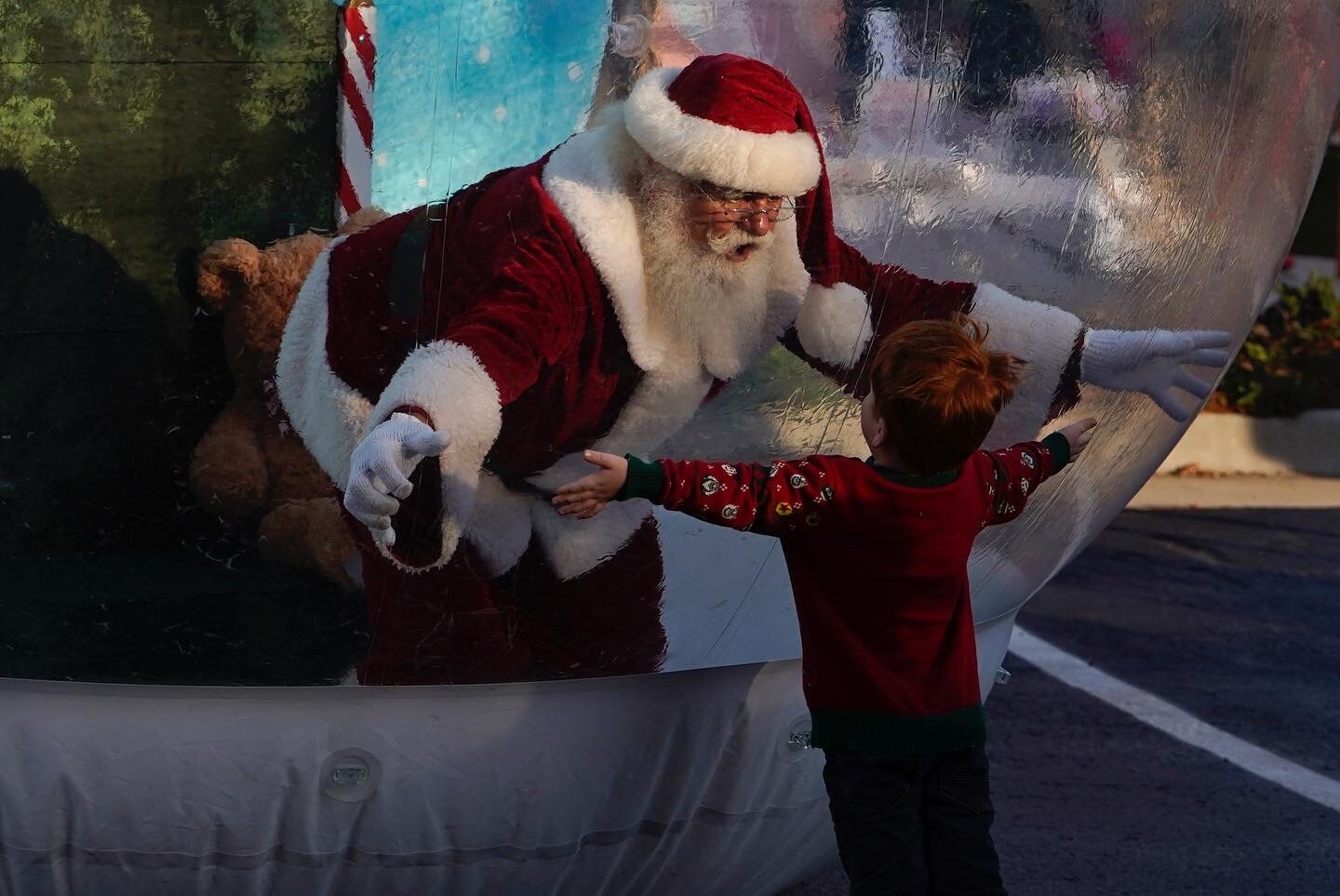  A boy hugs Santa Claus through a plastic bubble to protect against COVID-19 at an event in Oklahoma City, Oklahoma. Nick Oxford/Bloomberg 