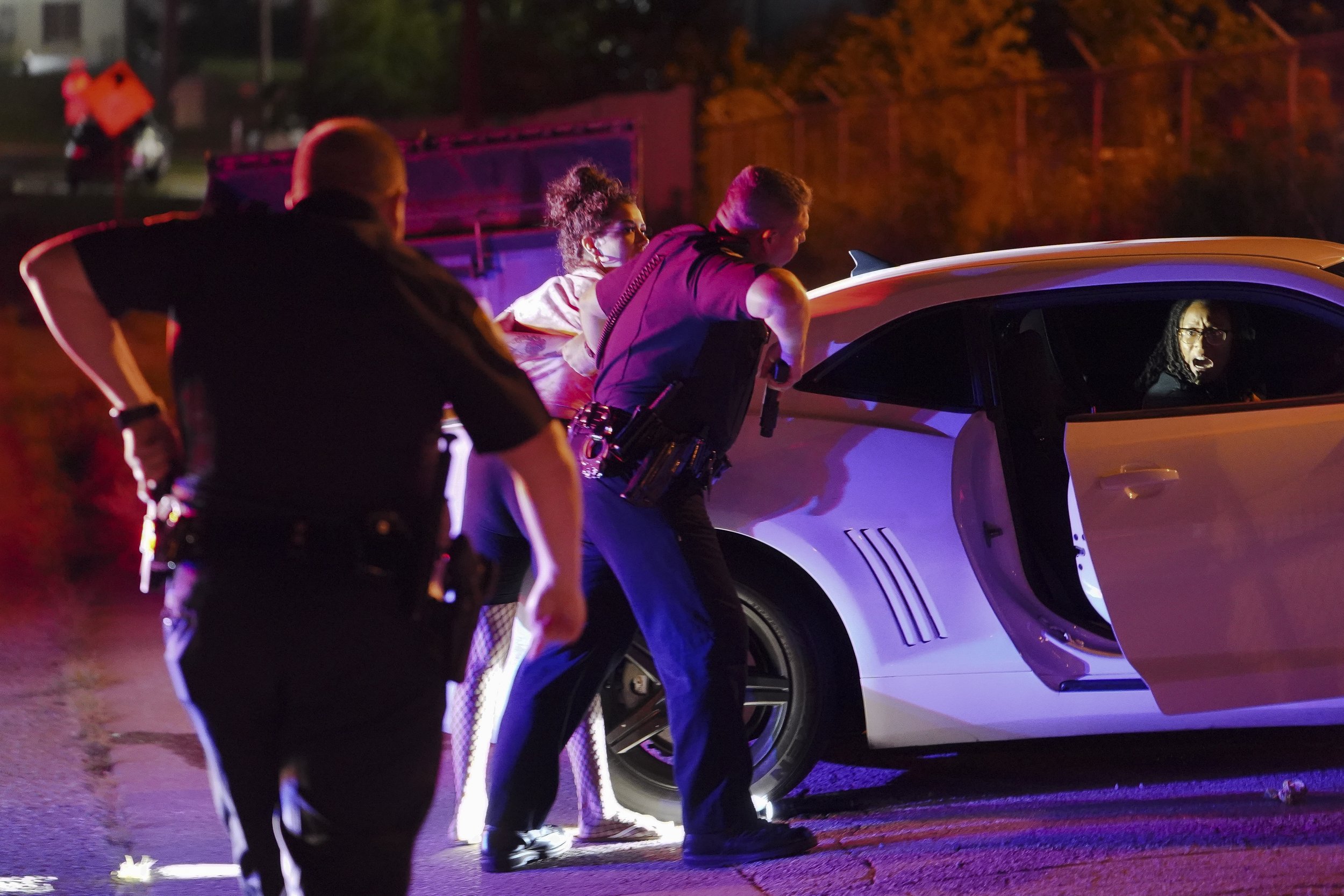  Valley Brook police officers confront a driver that had a gun in the vehicle after initially stopping when they saw the passenger urinating outside of the car in Valley Brook, Oklahoma on Saturday July 10, 2021. CREDIT: Nick Oxford for The New York 