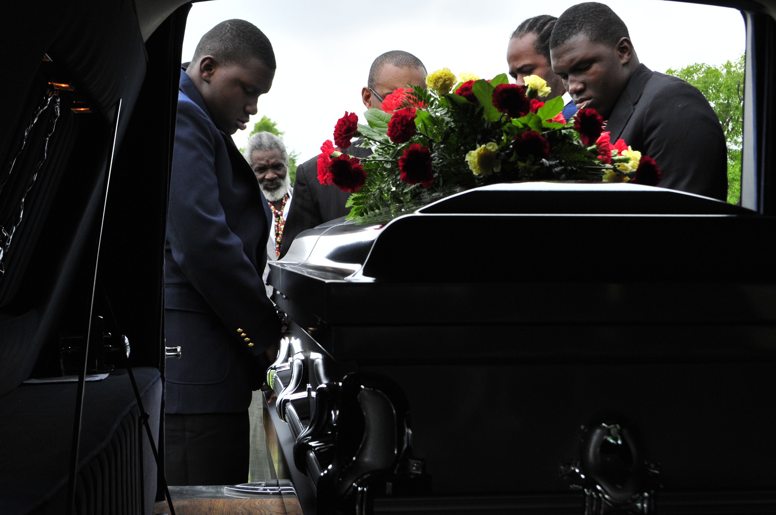  Family and friends lift the coffin of Bobby Clark out of the hearse at his funeral in Tulsa, Oklahoma. 