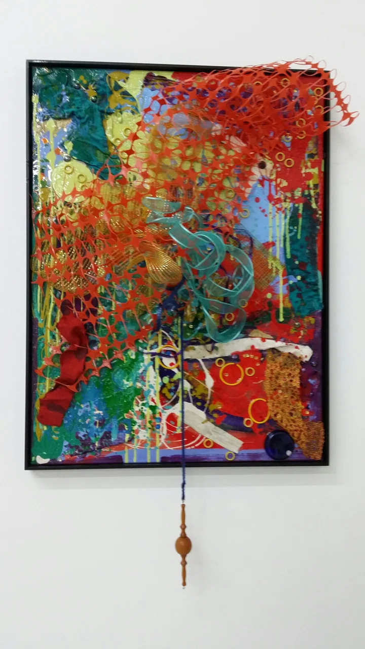 In My Head , paint, fabric, rubber, wood, ribbon and resin on canvas, 31"w x49"h x 10"d