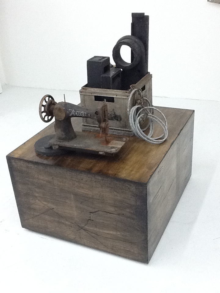 Objects of Industry , mixed media assemblage of found antique objects on wood base.