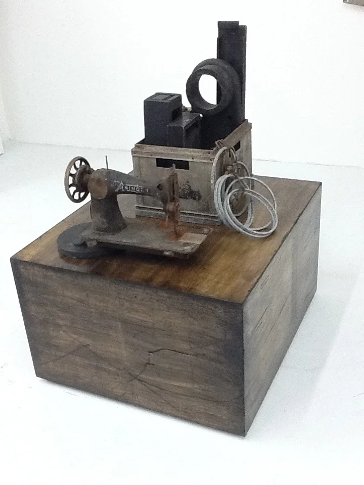Objects of Industry , mixed media assemblage of found antique objects on wood base.