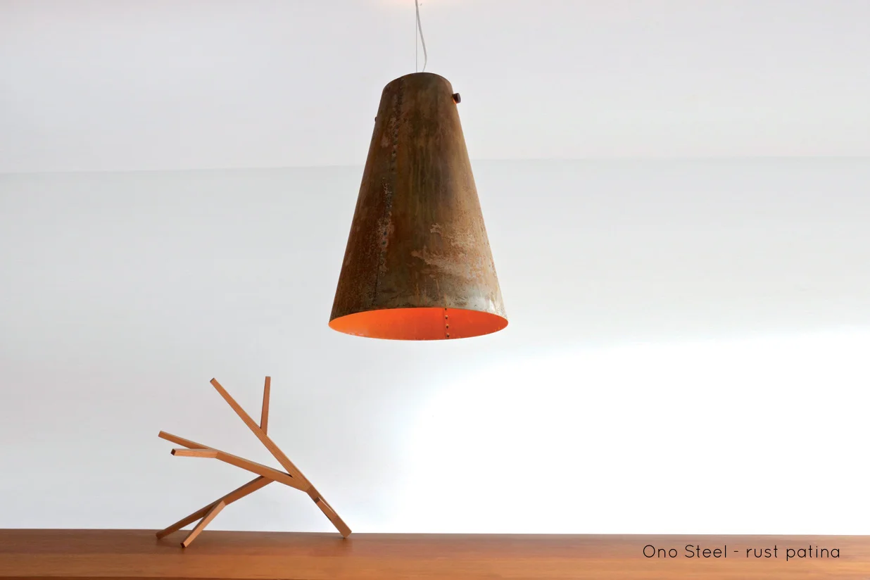 Ono Steel Pendant | With the Ono Steel light we explore the beauty and warmth of rusted metal. The Ono Steel is hand riveted, lit with an LED lamp and hung from a solid walnut spindle. | propellor.ca