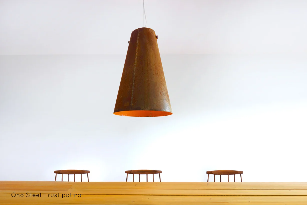 Ono Steel Pendant | With the Ono Steel light we explore the beauty and warmth of rusted metal. The Ono Steel is hand riveted, lit with an LED lamp and hung from a solid walnut spindle. | propellor.ca