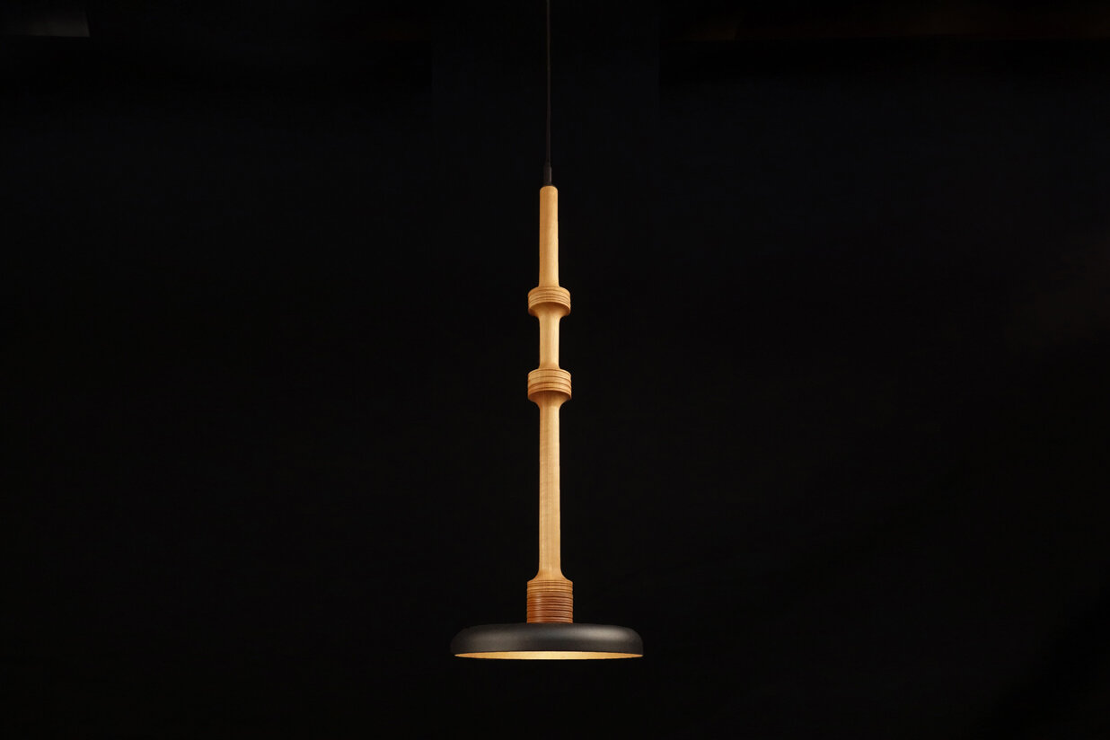 Stria pendant light in maple with black metal shade, 29 inches tall