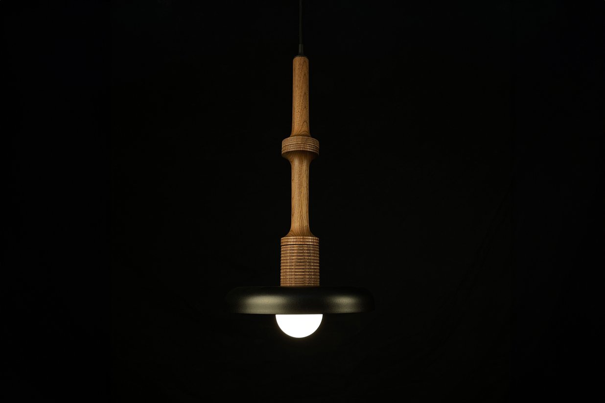 Stria pendant light in walnut with black metal shade, 20 inches tall