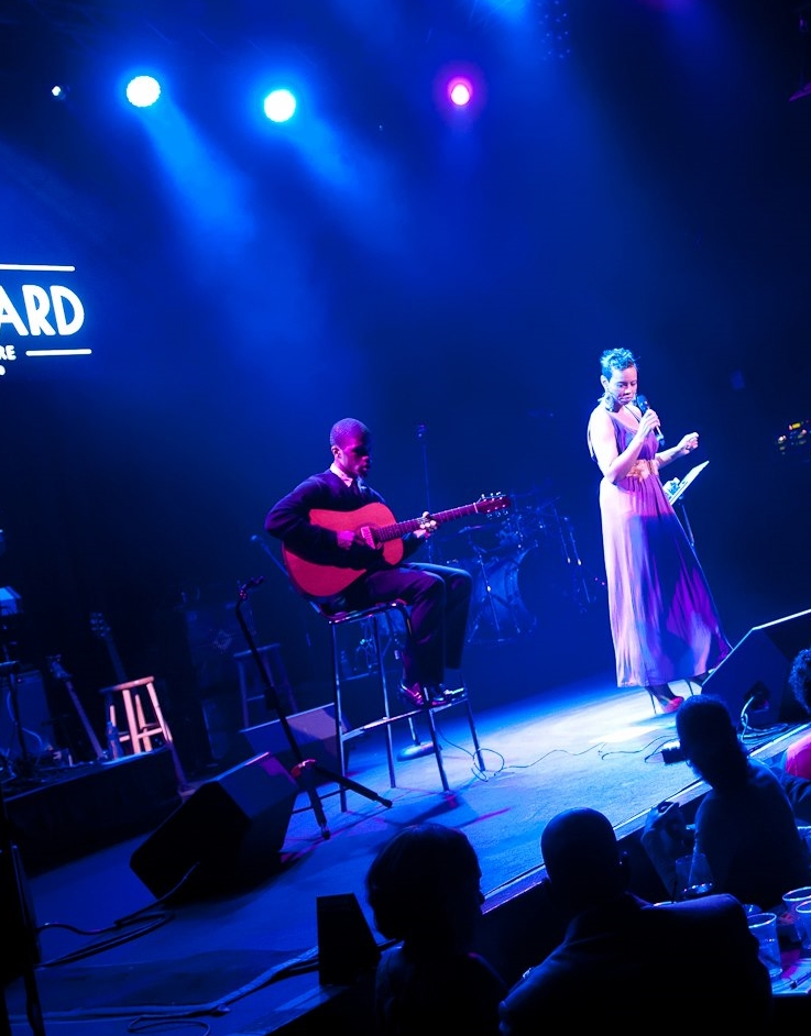 Guitarist Larry Mack performing with artist Temika Moore at The Howard Theatre, Washington, DC.