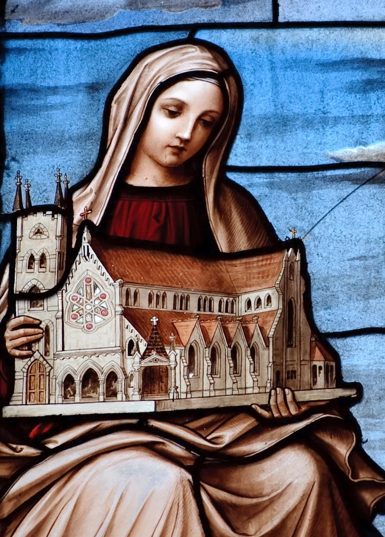 Detail of a stained glass window with Mary holding Our Mother of Good Counsel Parish Church, Bryn Mawr, Pa. The window is one of fifteen windows made by the Tirolese Art Glass Company for the Church, which opened in 1885.