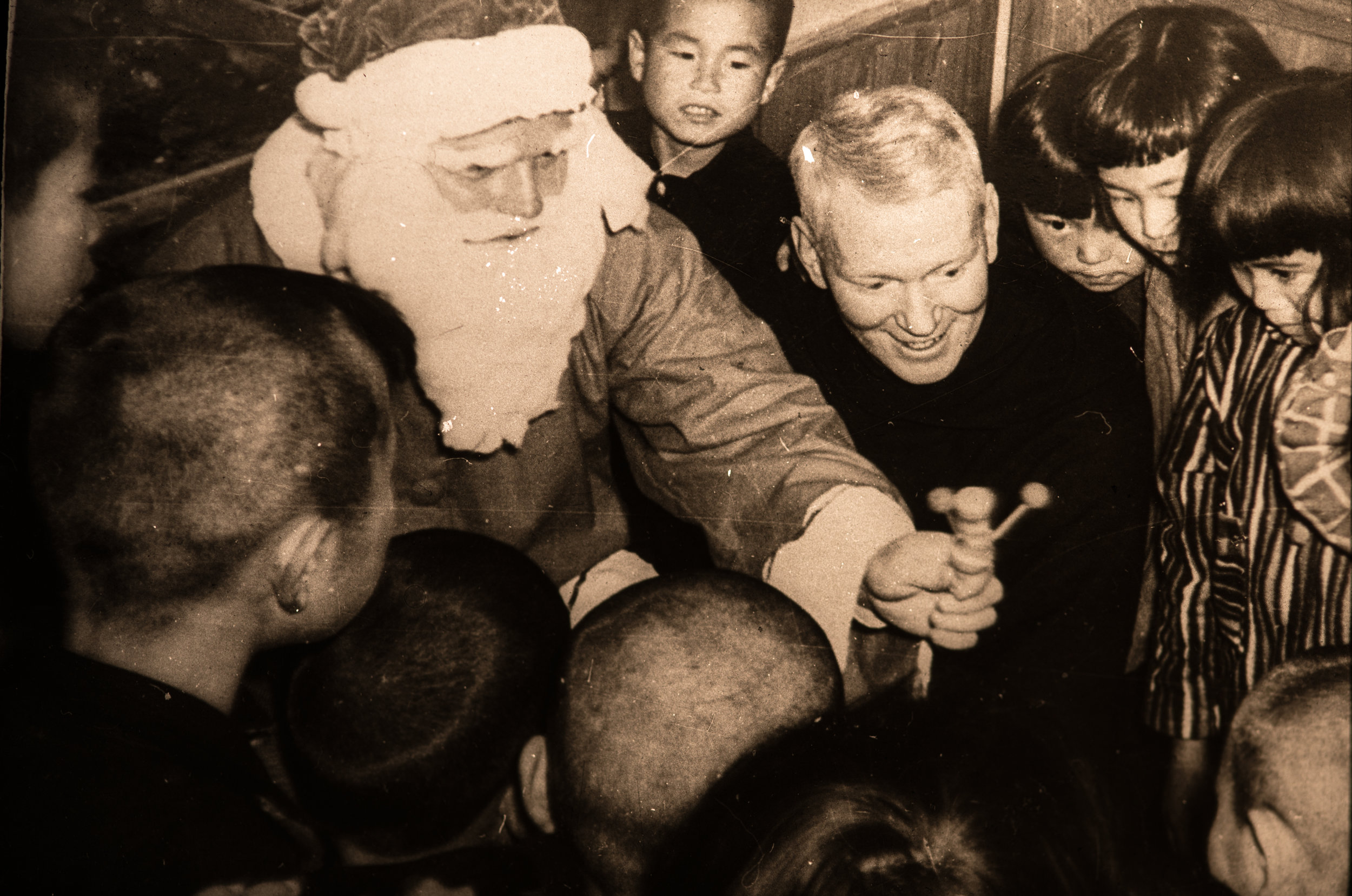 Dec 1955 Father Robinson (Santa) and Father Purcell with children.