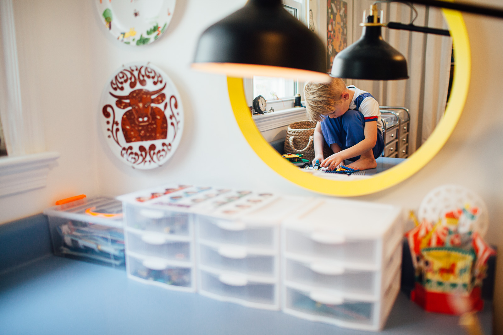 Boy playing legos on a desk