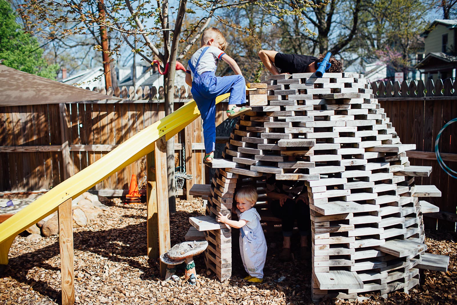 boy climbing a homemade hive