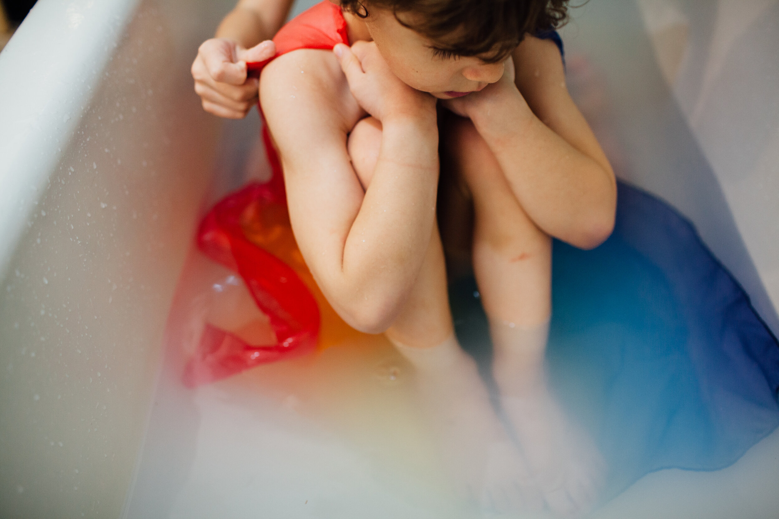 boy in bath with rainbow silk .jpg