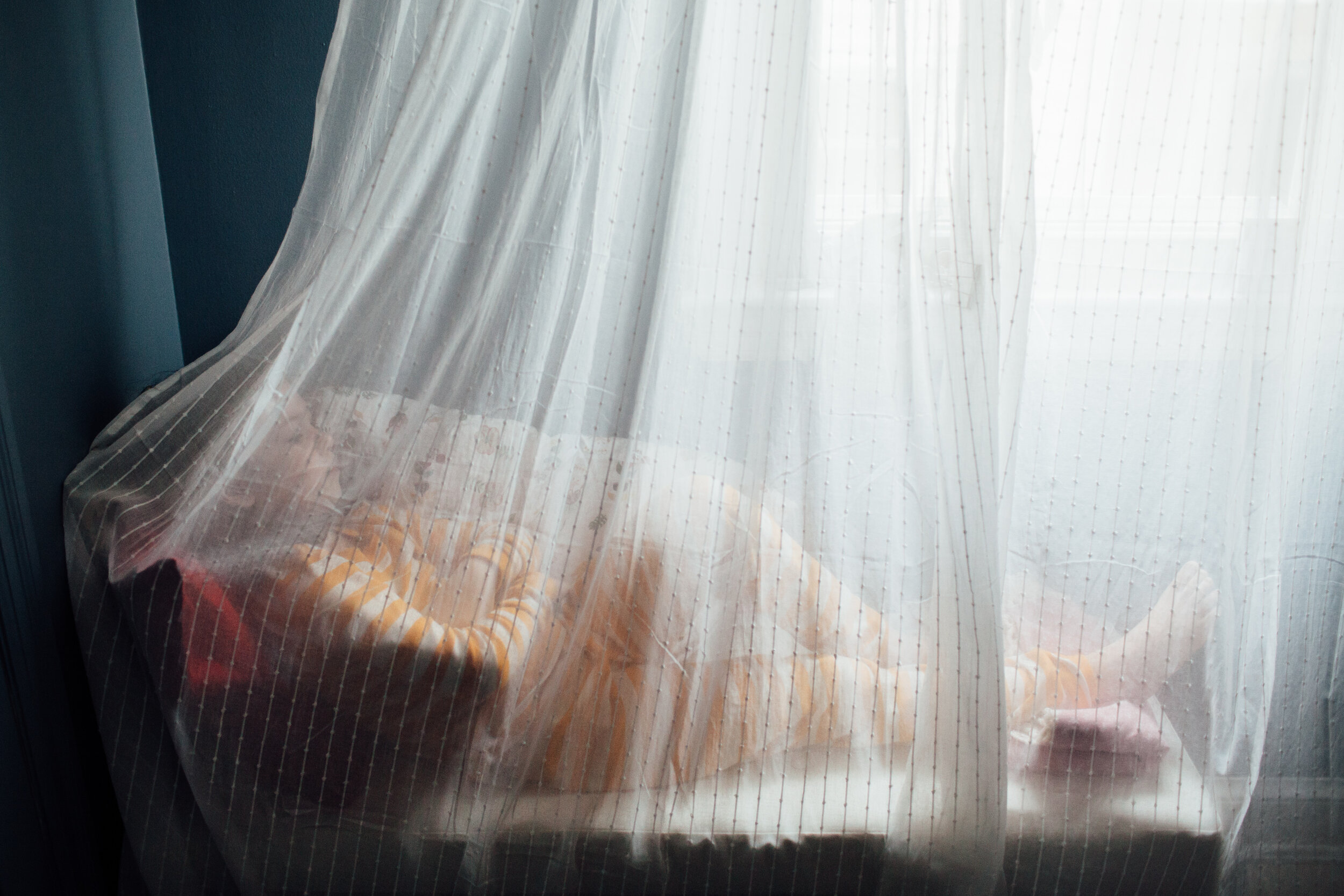 girl daydreaming behind veil.jpg