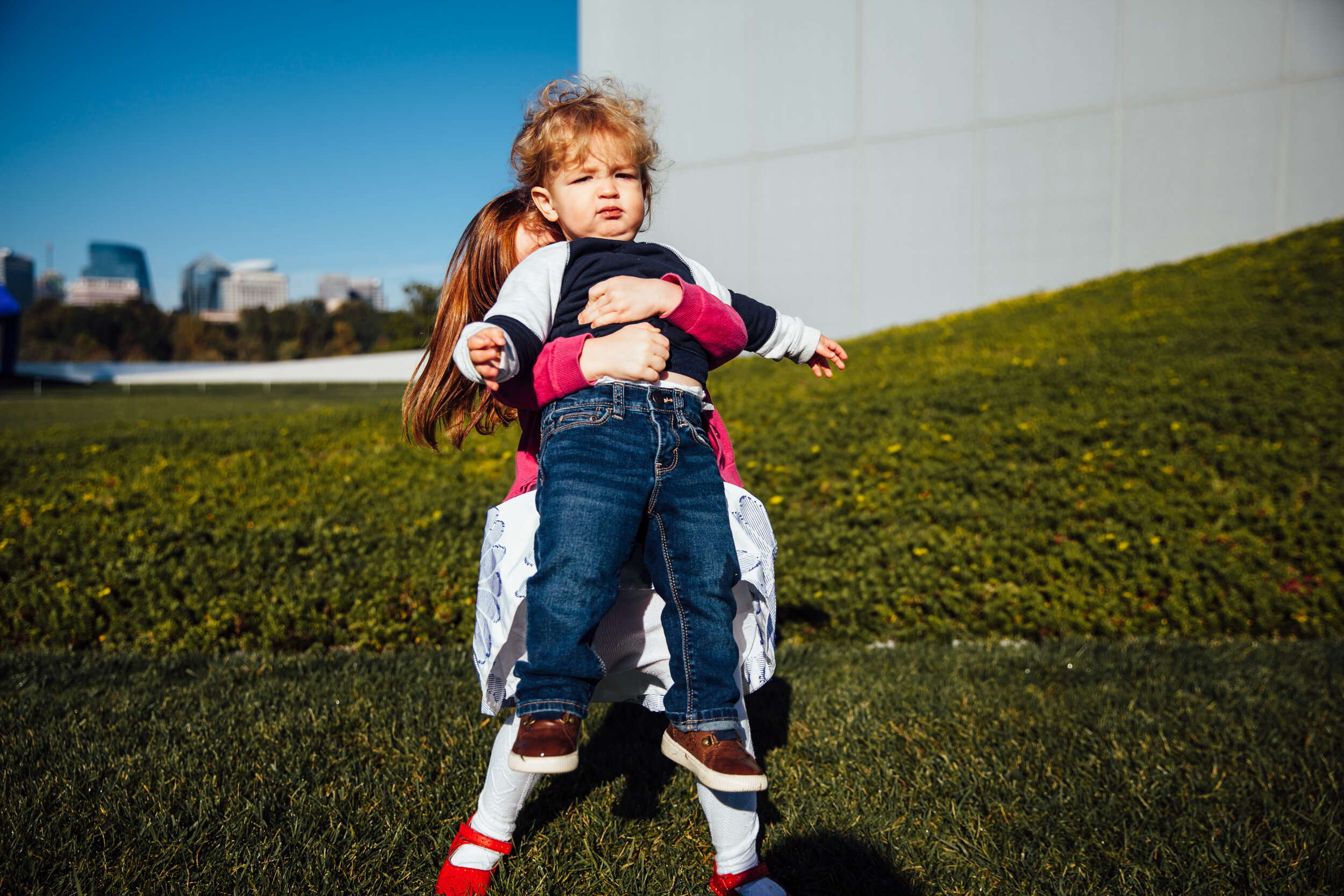 sister lifting her brother.jpg