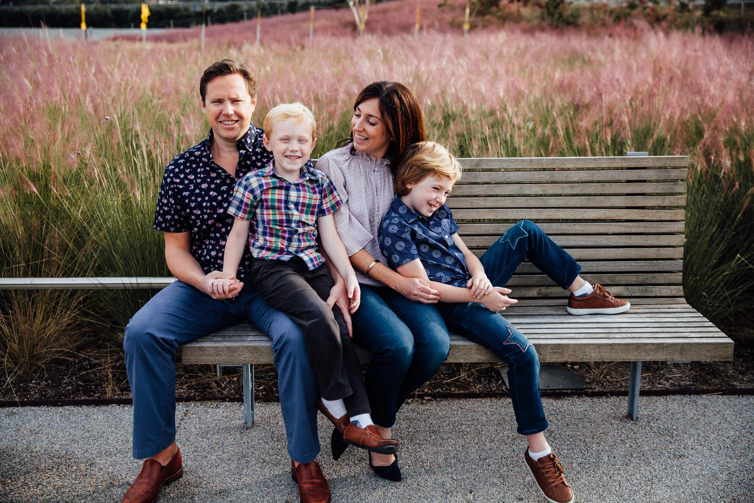 family with 2 boys sitting on a bench.jpg