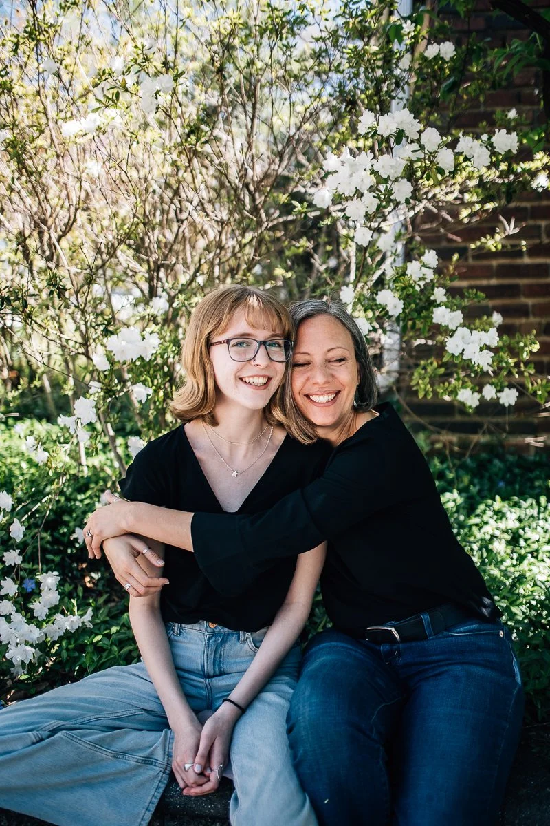 mother hugging her teenage daughter