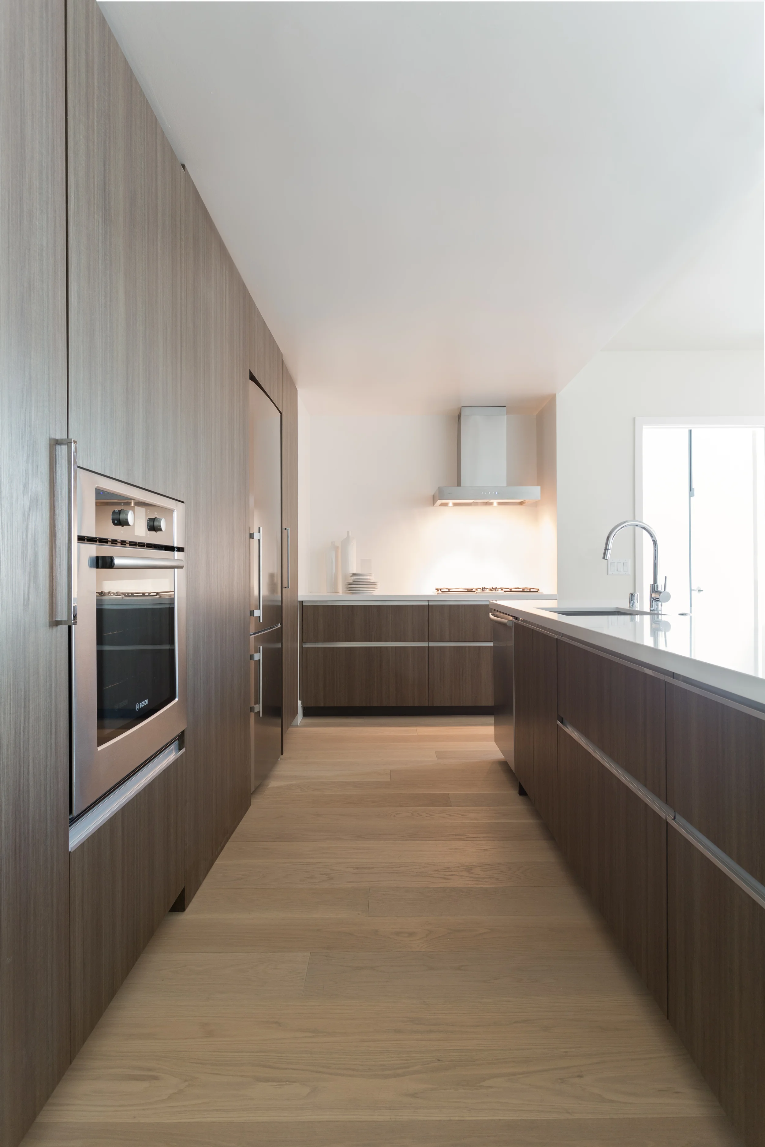  Integrated hardware provides a sleek, simple look, while eliminating the necessity for applied pulls, which can catch on sleeves and pockets. 