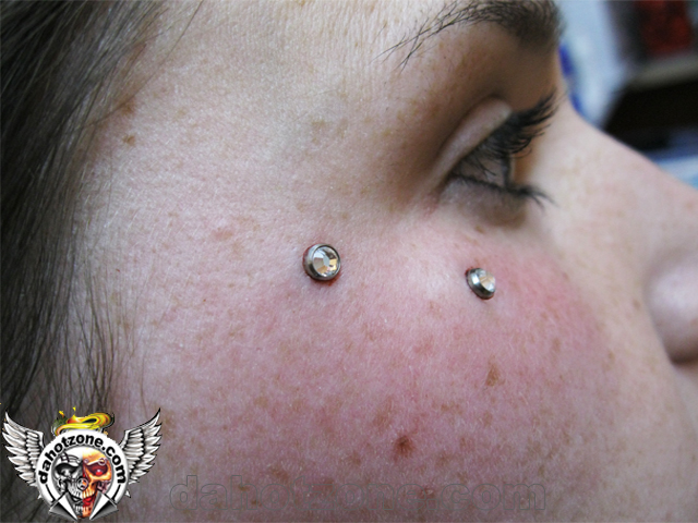 double dermal piercing face