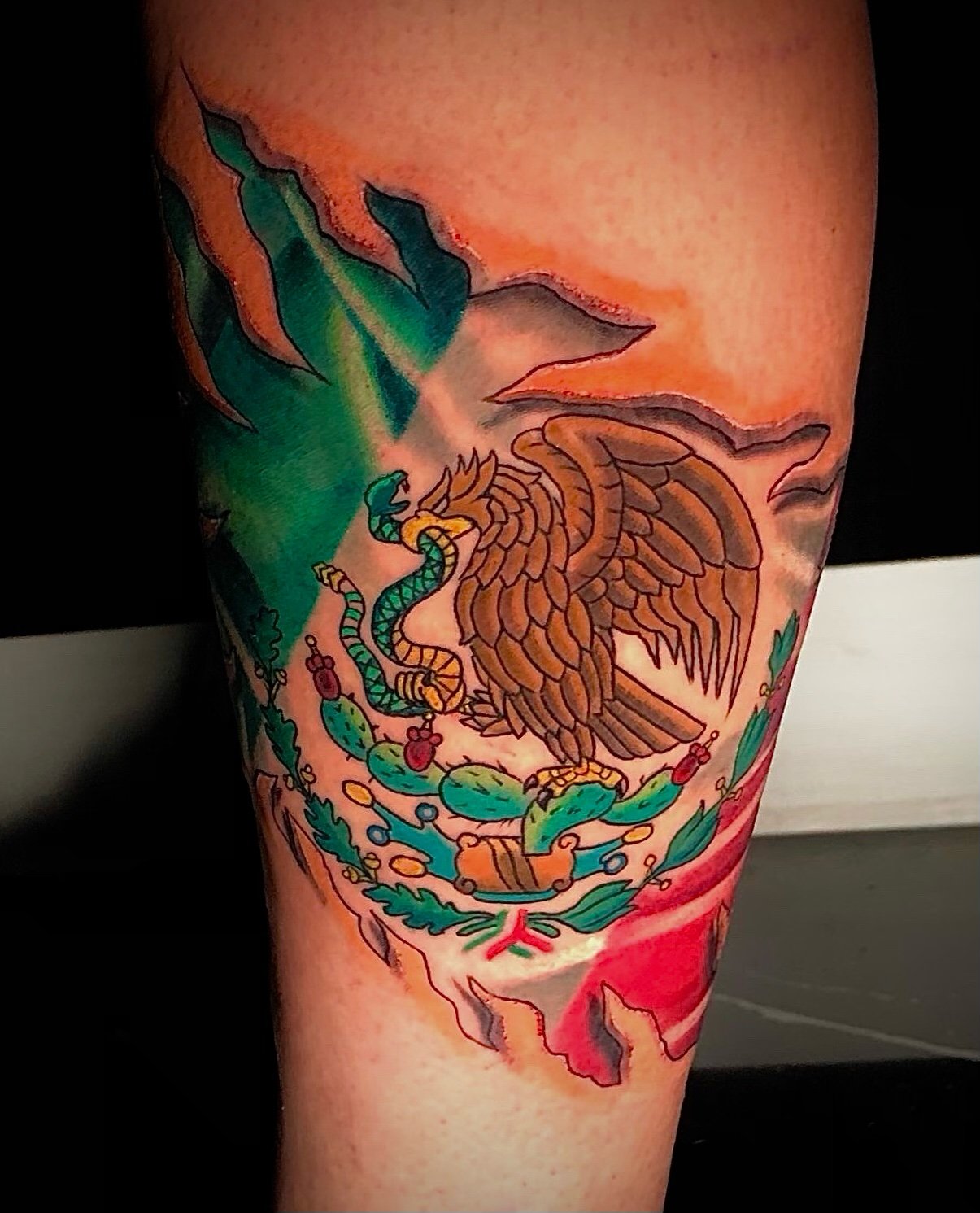 mexican flag tearing through skin