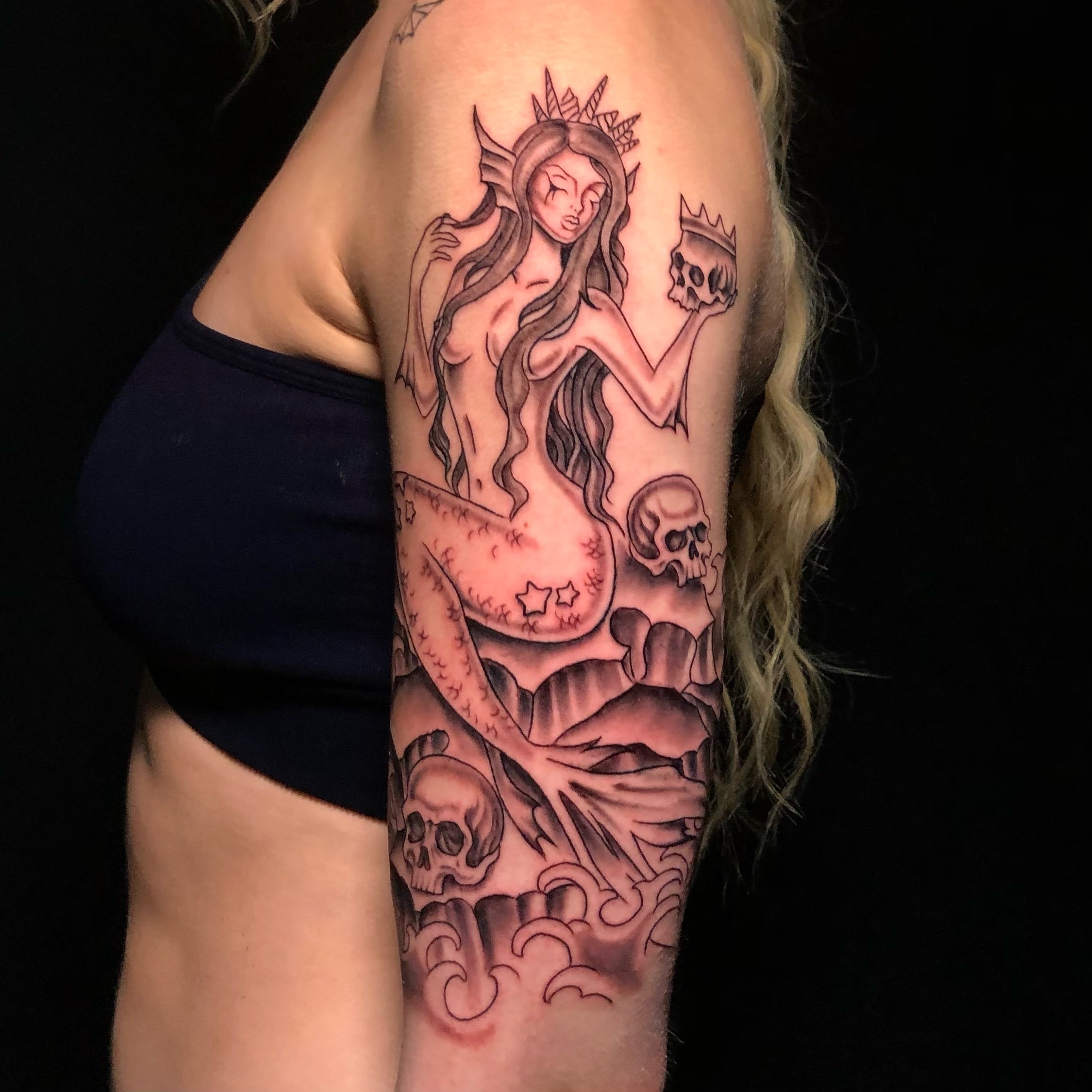 morbid mermaid with skulls 