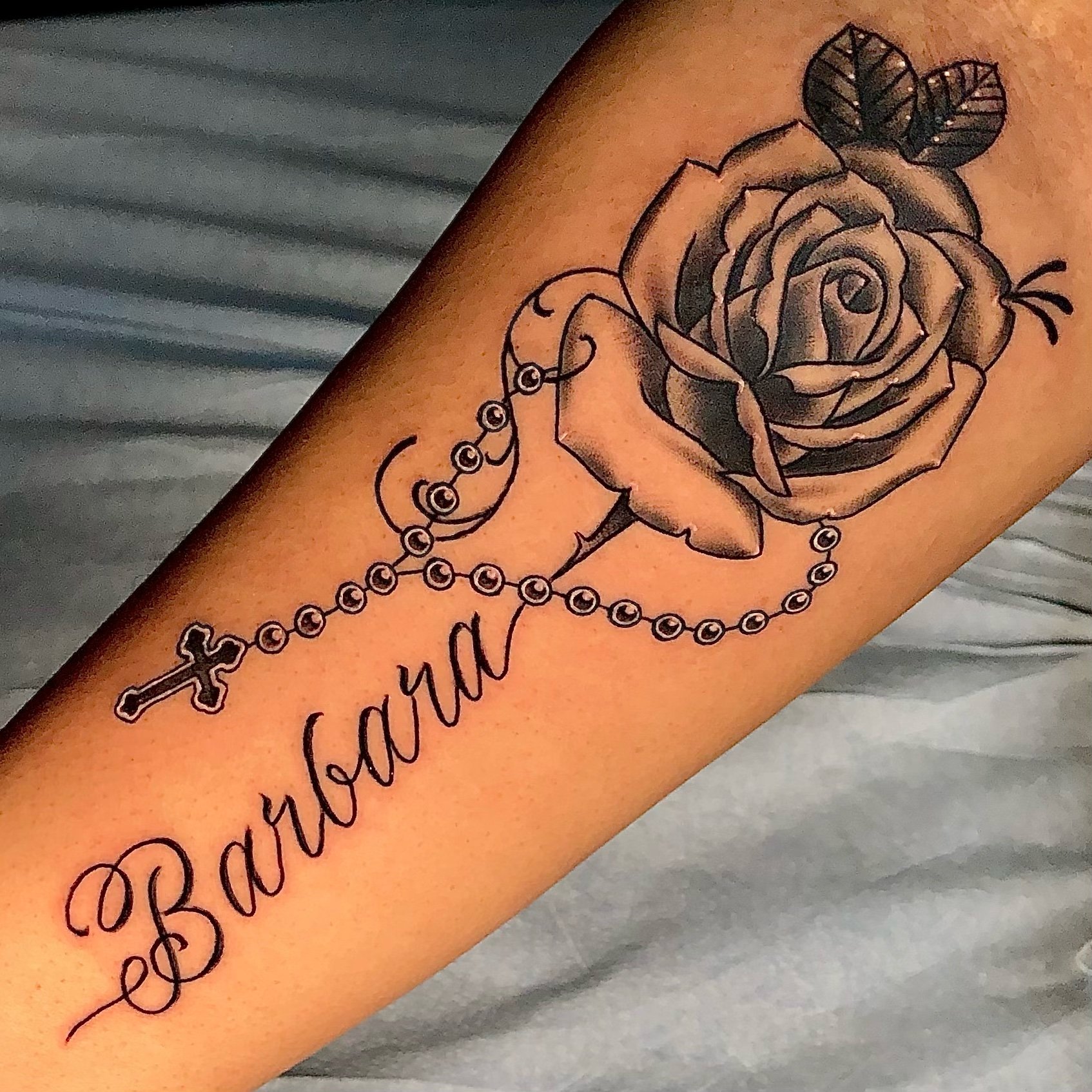 rose with rosary and name