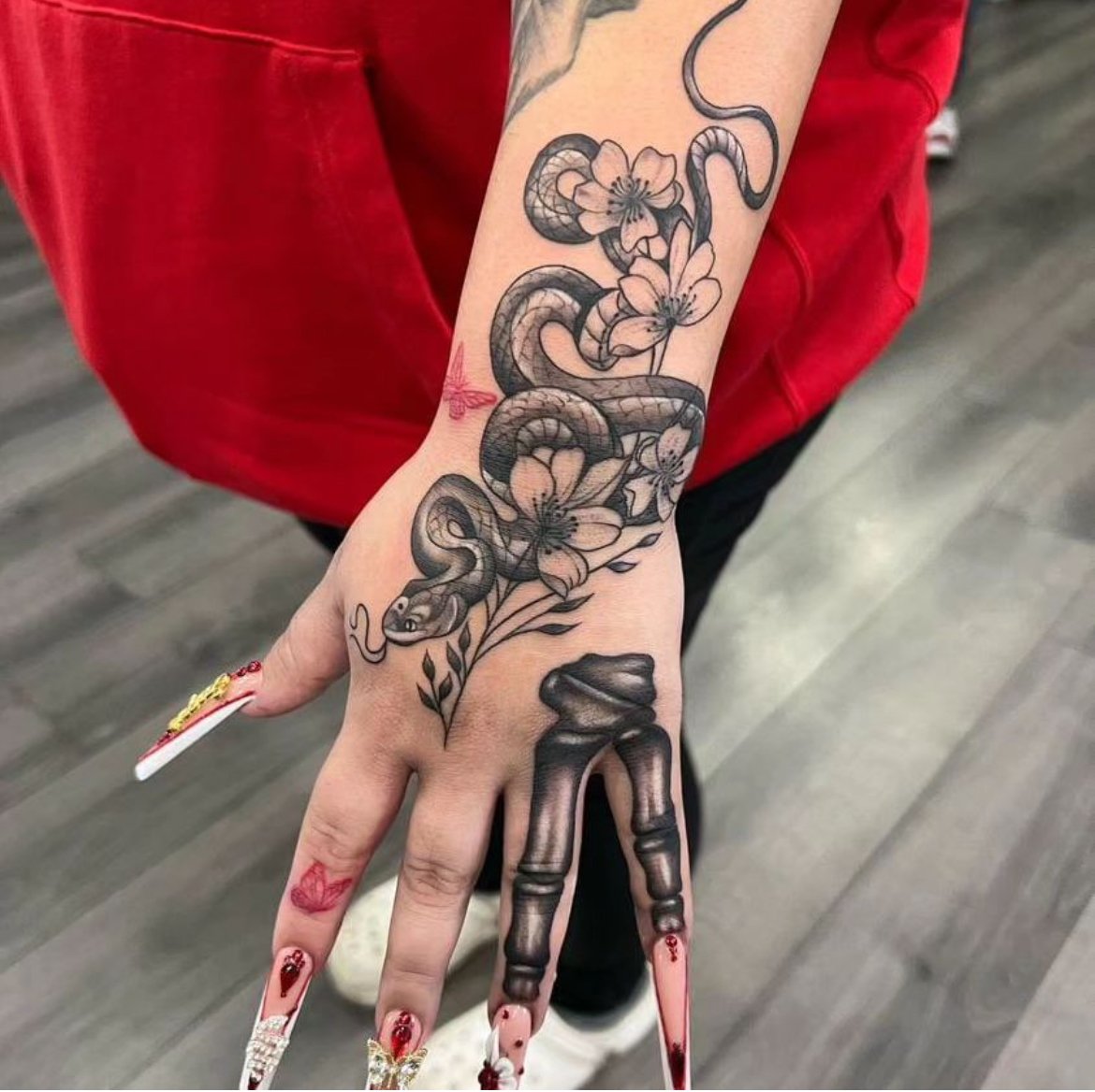 snake black and grey hand