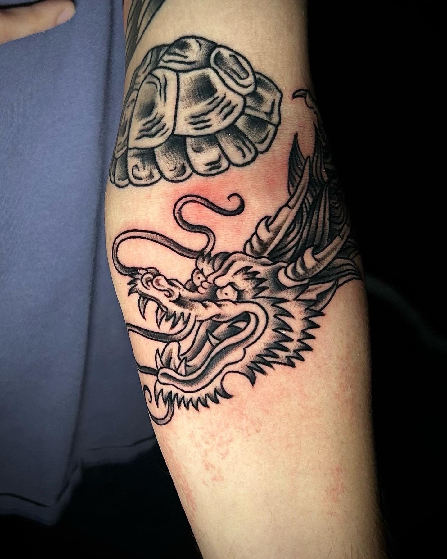 traditional dragon wrapping on arm