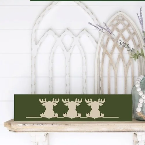 4x16 3 moose sitting bum christmas mock up .jpg