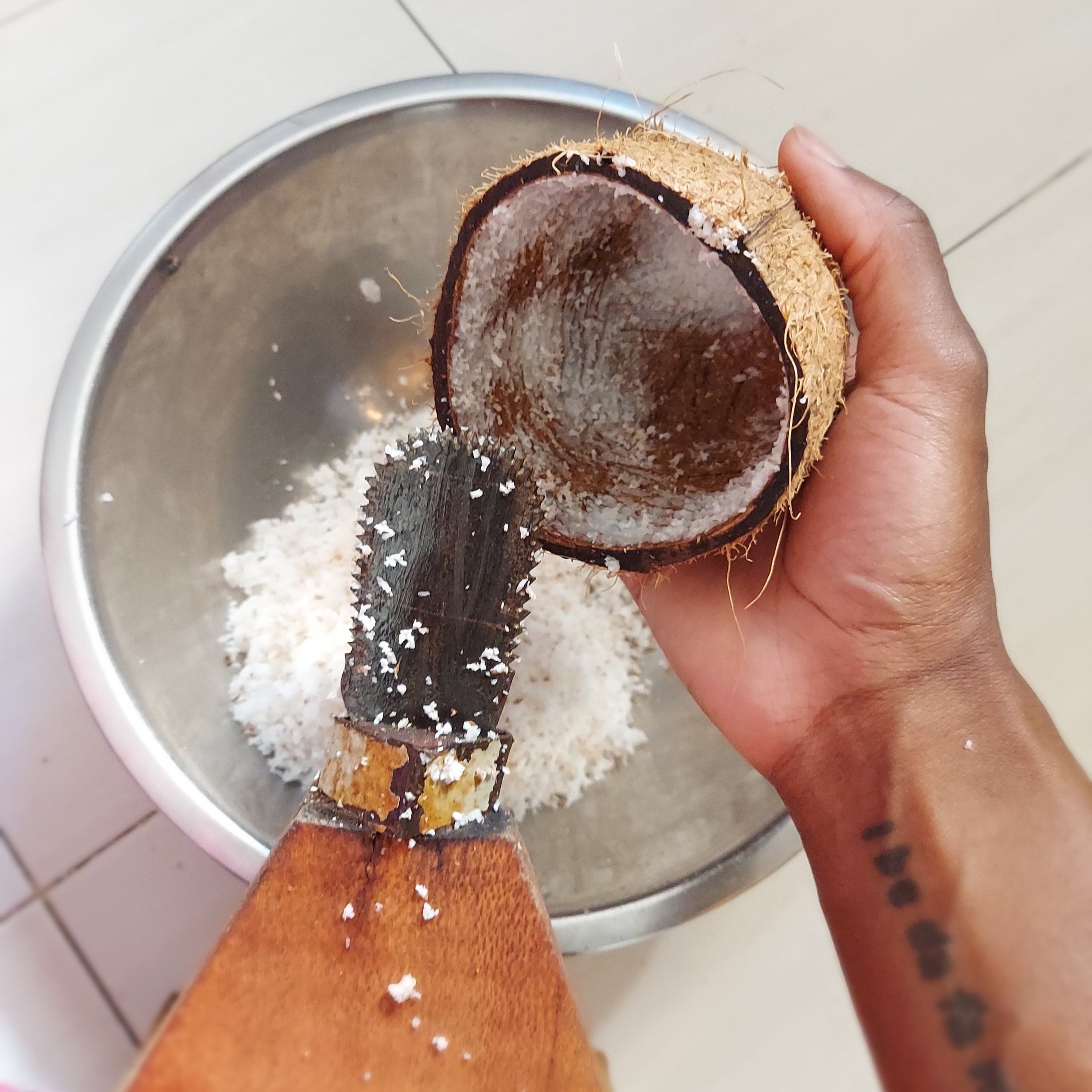 Grating the coconut on the Mbuzi