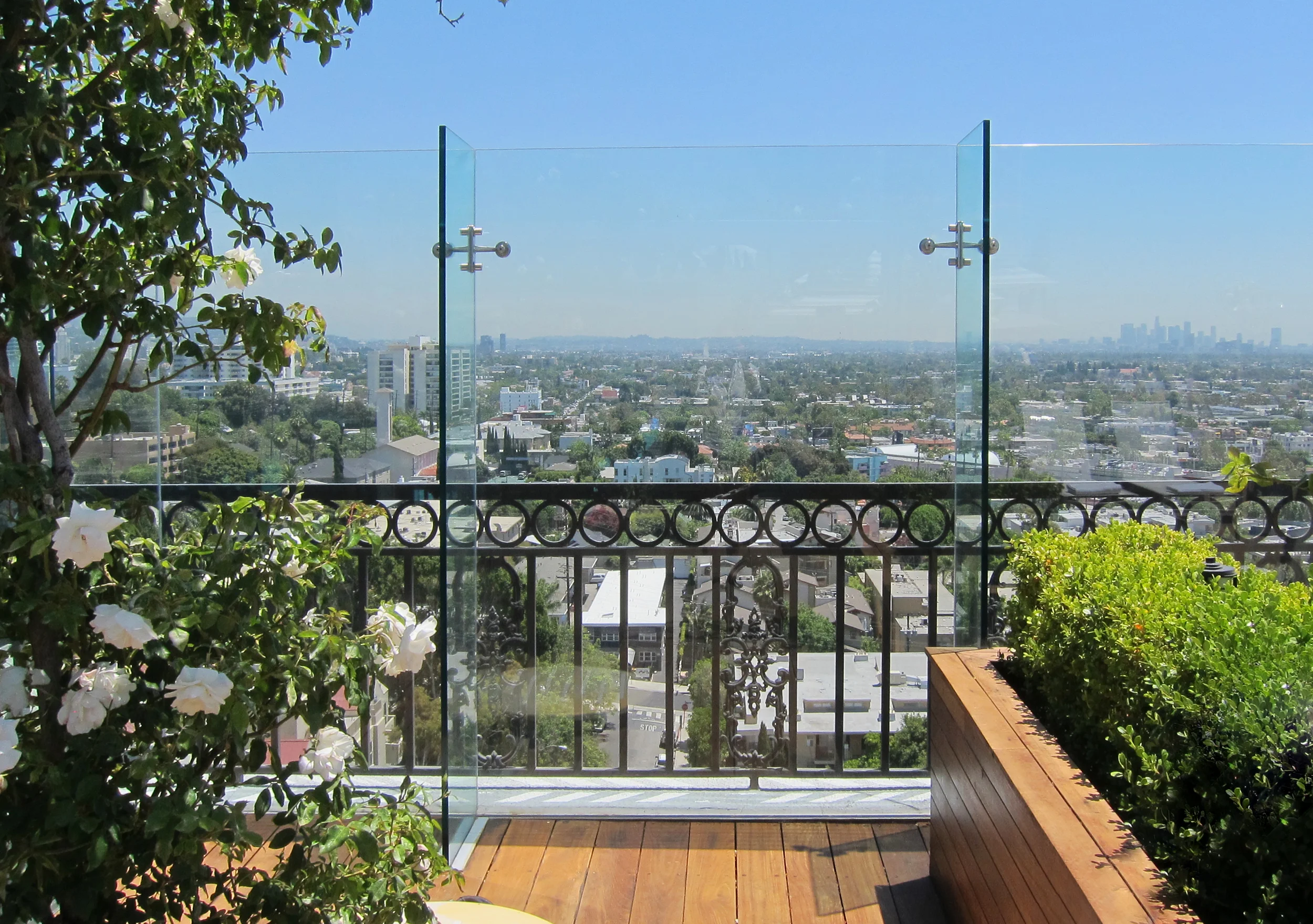 Panoramic glass views from the rooftop pool.