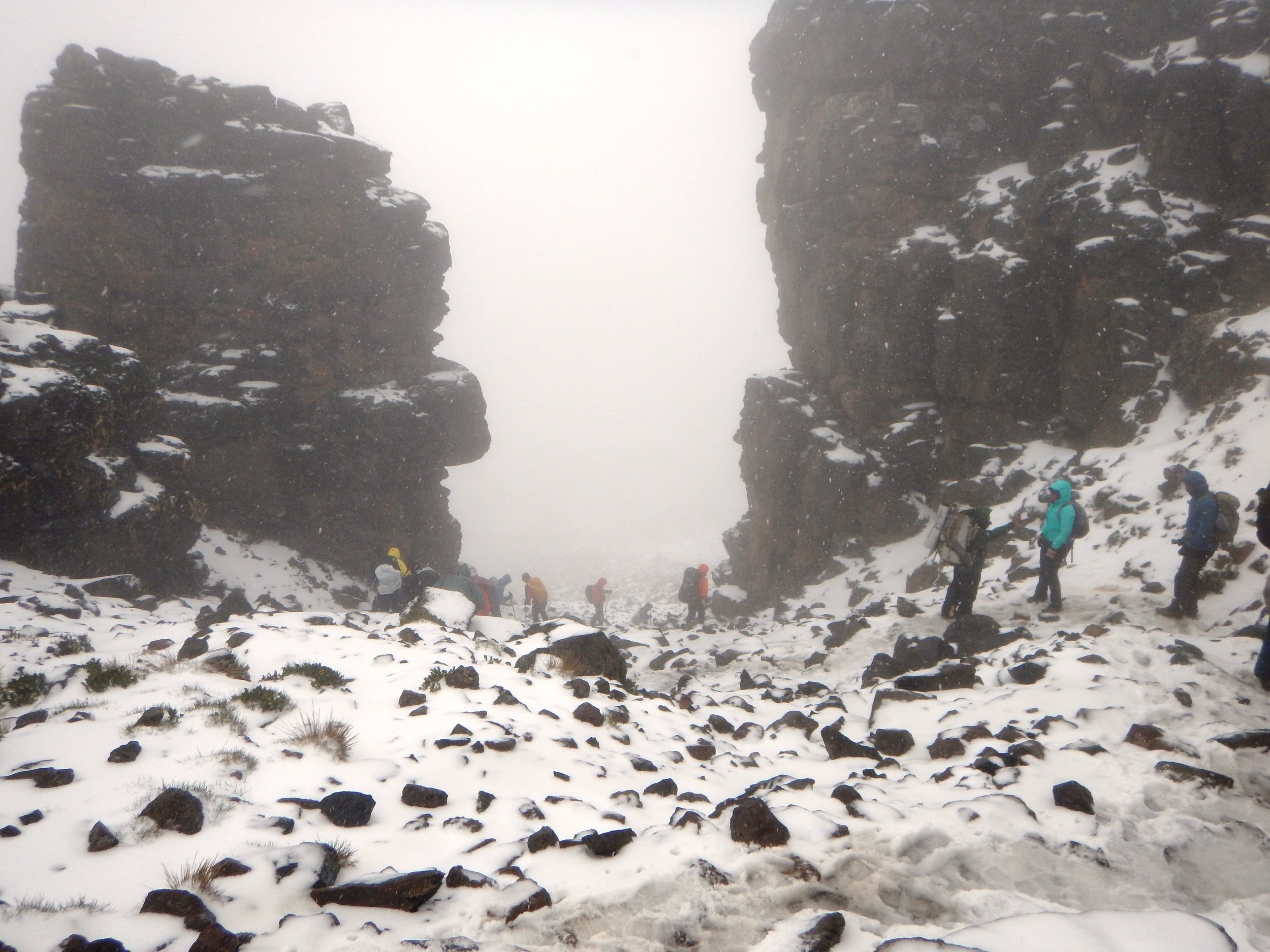 climbing back down from Lava Tower in a wet snow storm