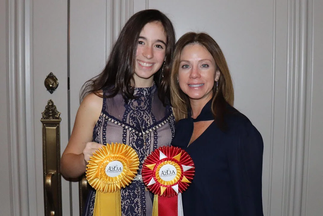 Paloma and her mother Michelle posing with Paloma's Long Stirrup awards.
