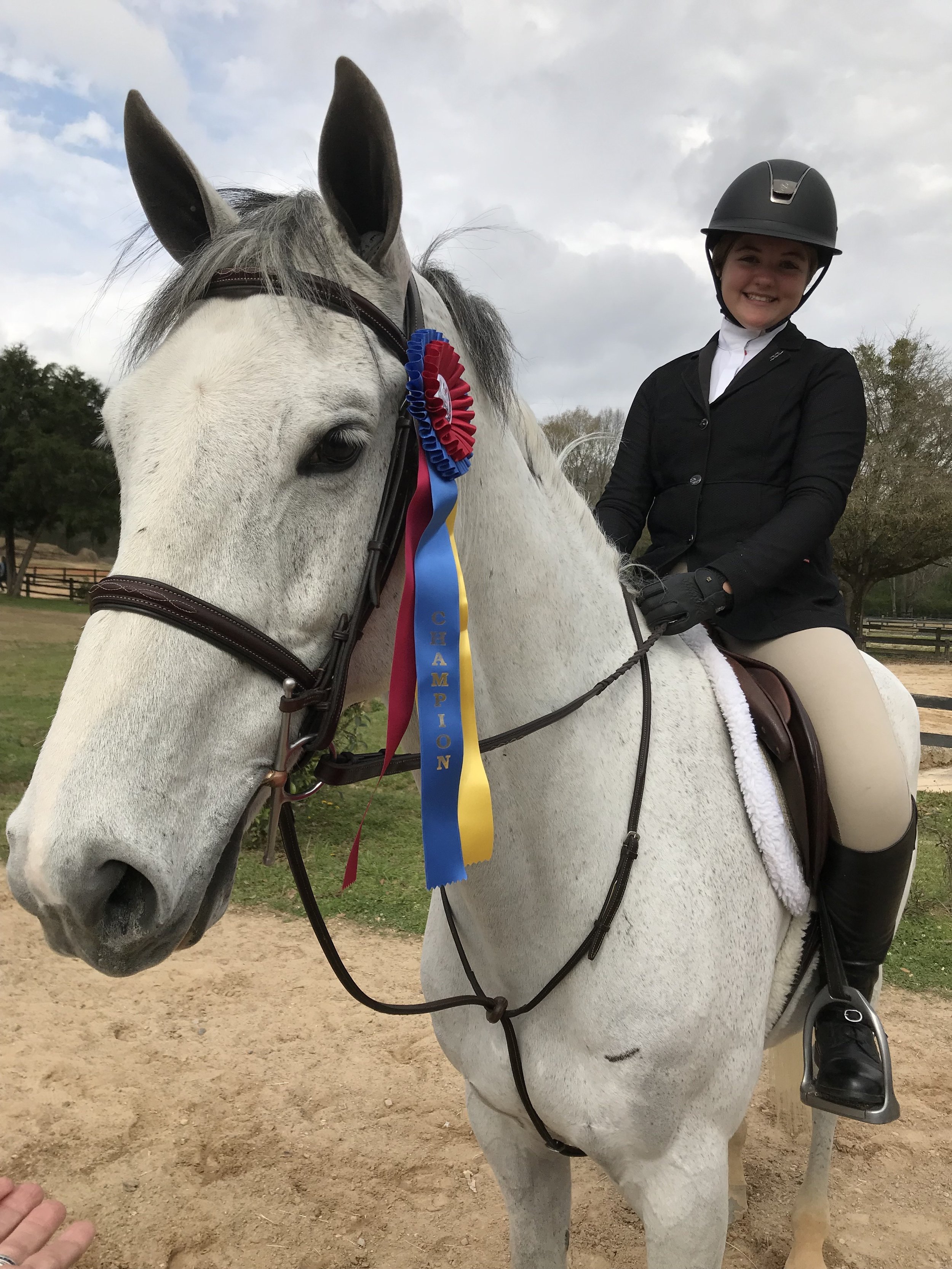 Lauren and Z show off their champion honors!
