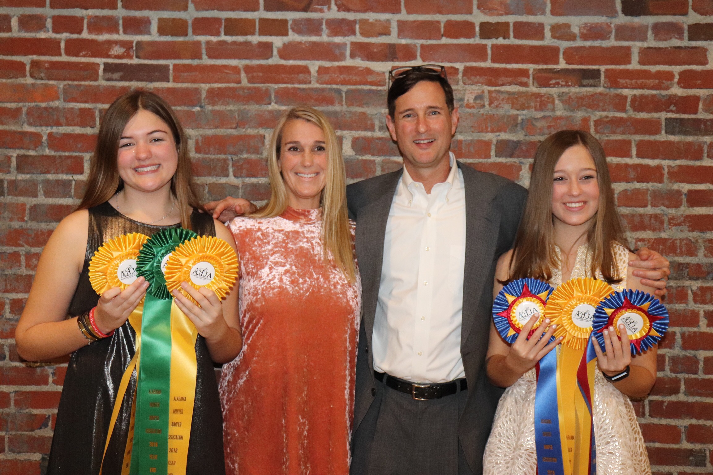 Lauren (left) and Sydney Velazquez with parents Romney and Andy.