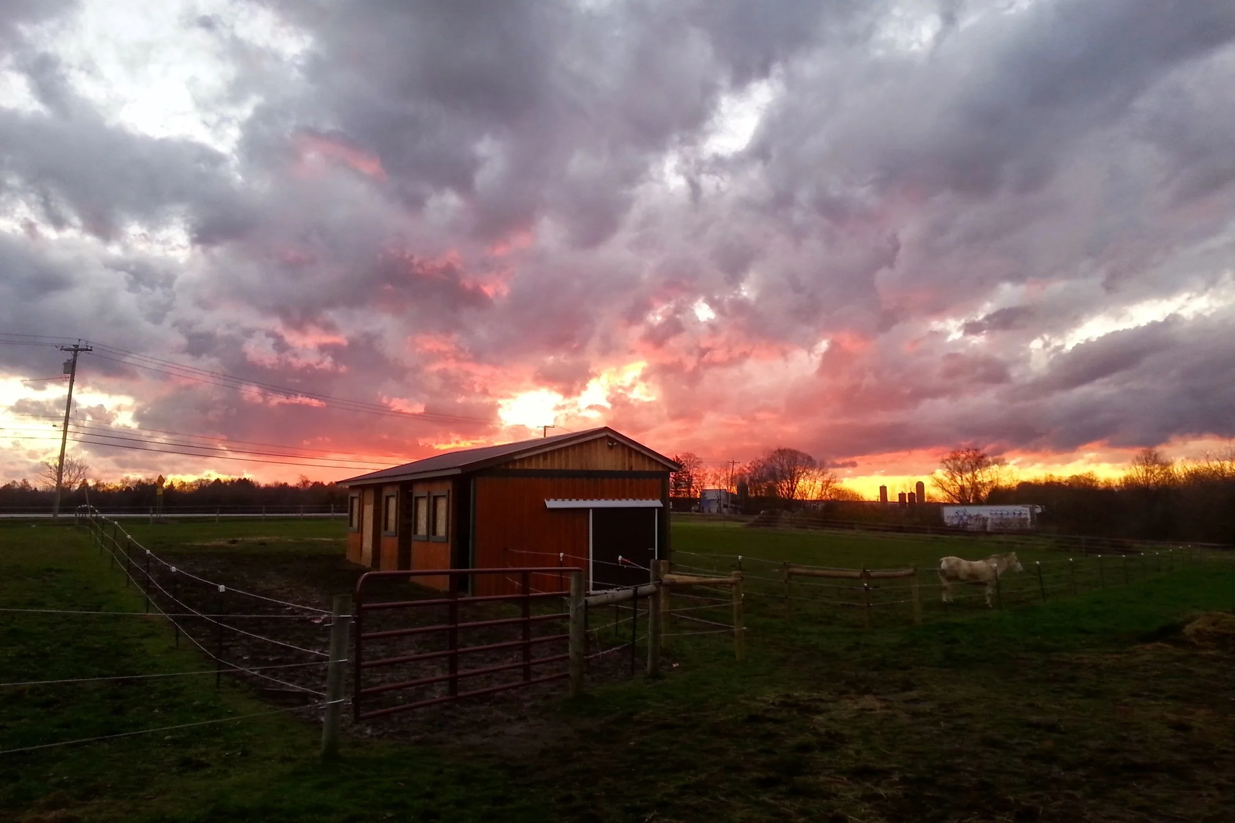 Beautiful sunset over the side barn.