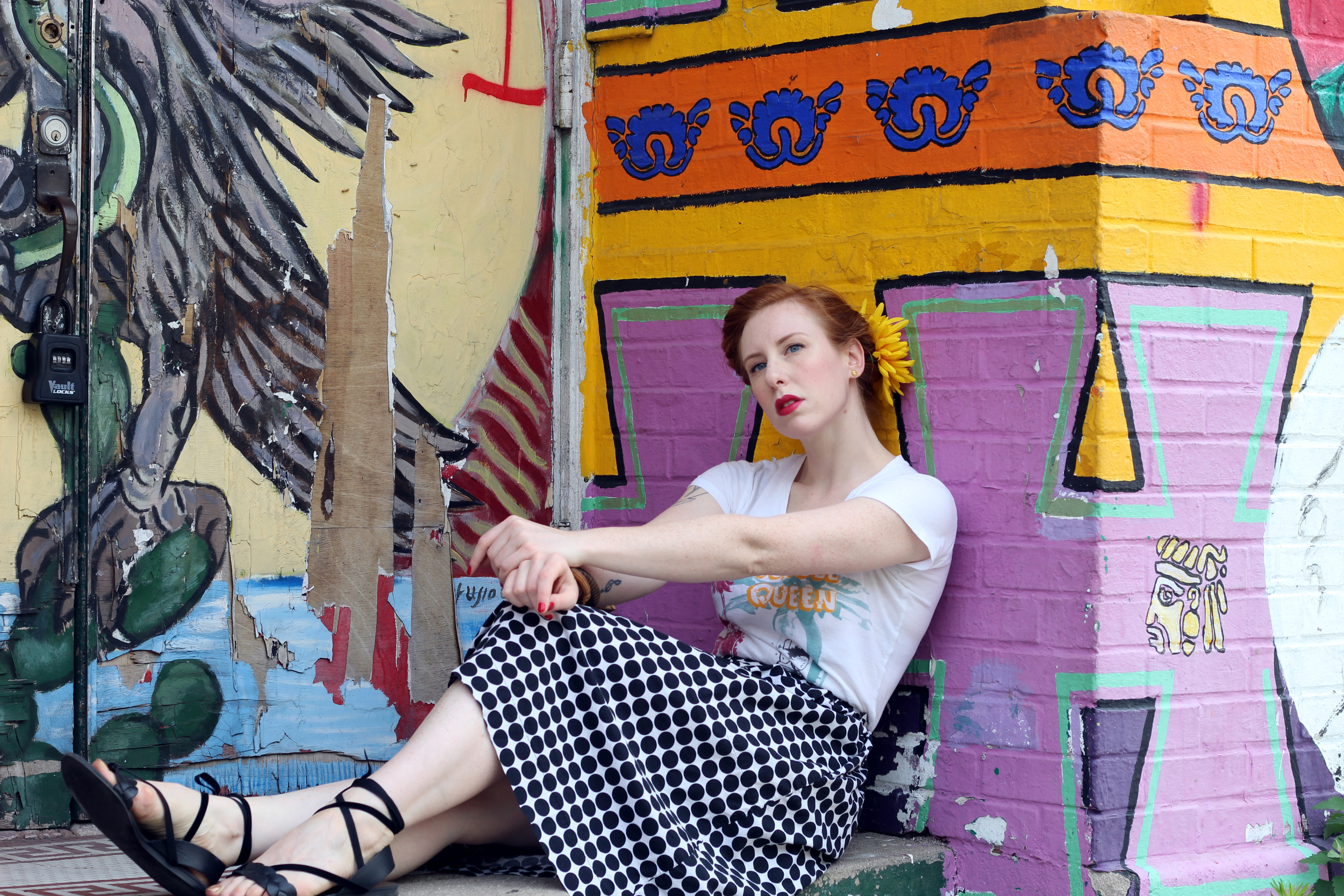 Zella Maybe in a polka dot skirt and Jungle Queen Bettie Page top, and a pair of ankle wrap sandals. Shot in Pilsen, Chicago.